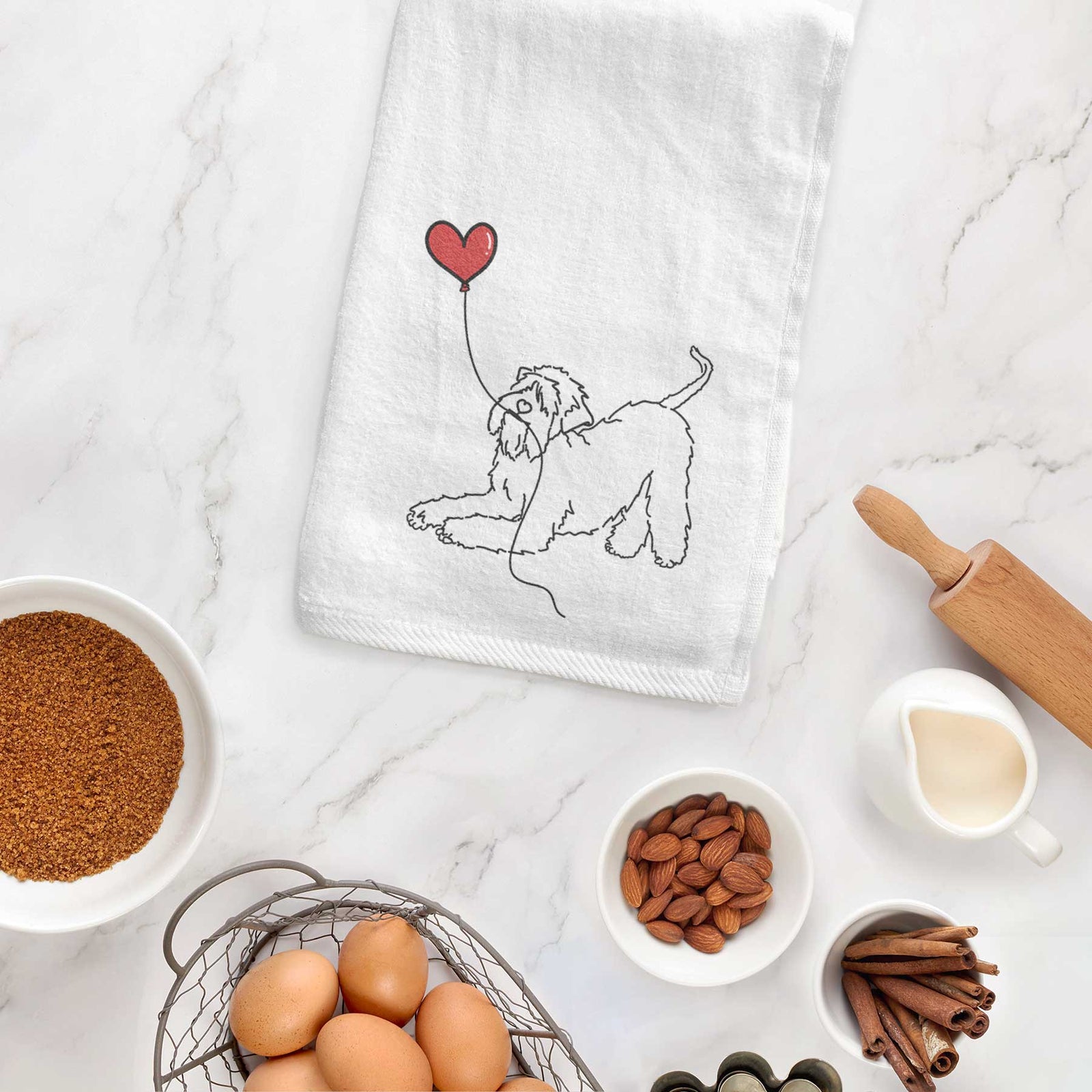 Minimalist line drawing of a Soft-Coated Wheaten Terrier Heart String holding a heart balloon on a decorative hand towel