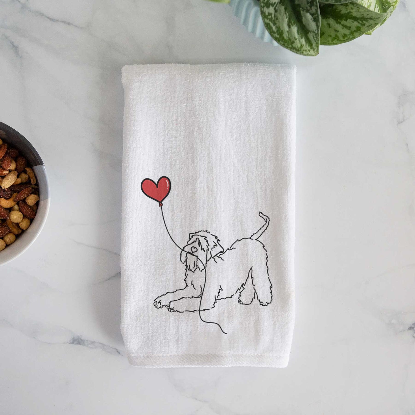 Minimalist line drawing of a Soft-Coated Wheaten Terrier Heart String holding a heart balloon on a decorative hand towel