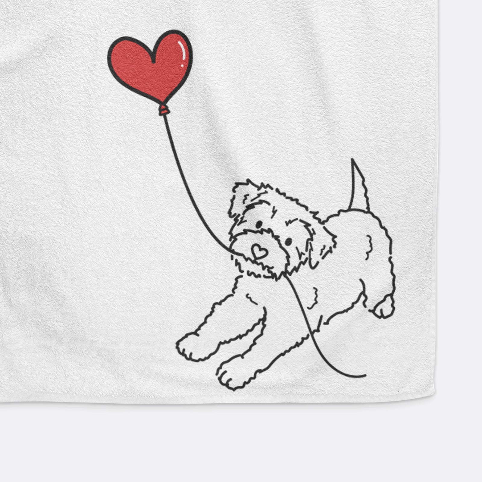 Minimalist line drawing of a Yorkiepoo Heart String holding a heart balloon on a decorative hand towel