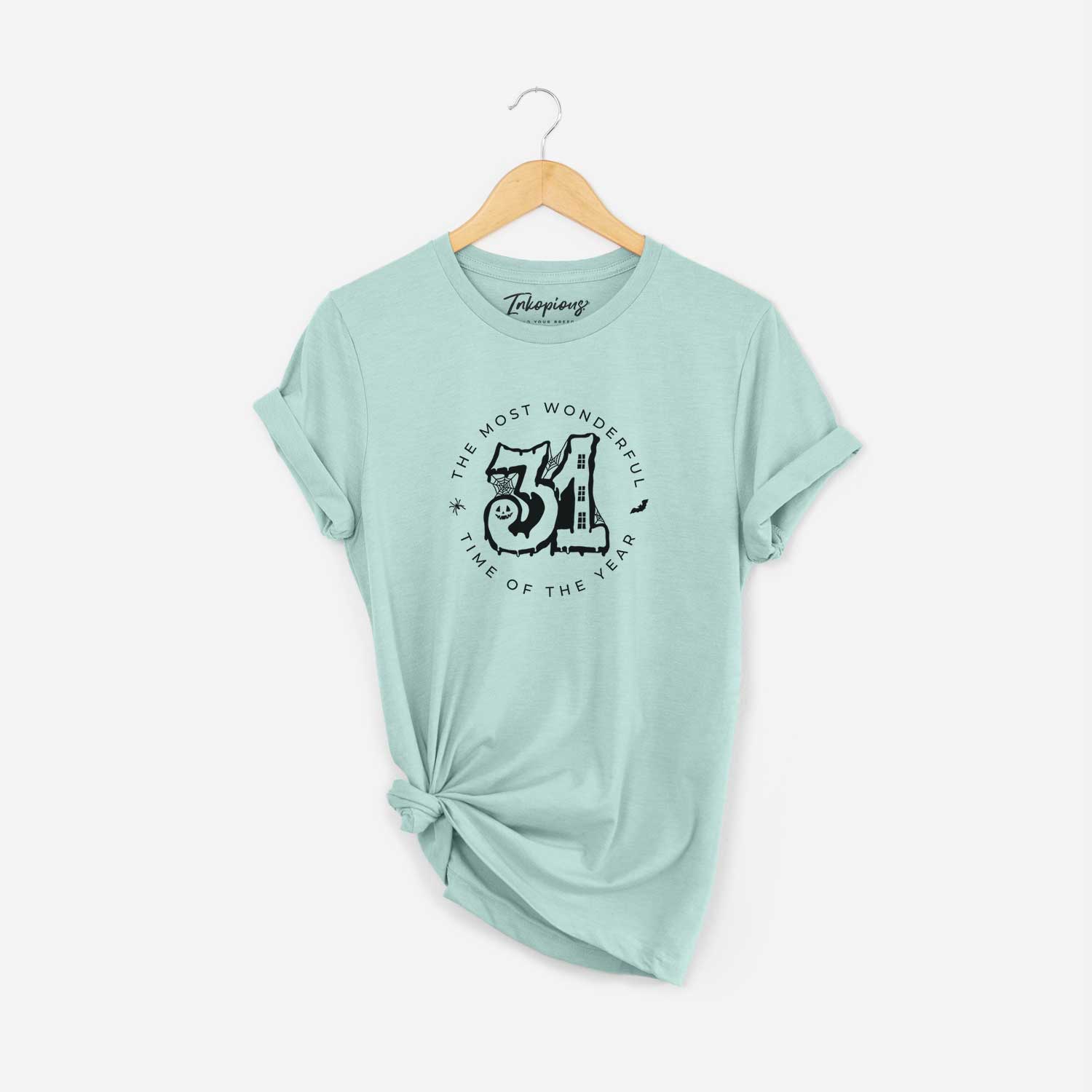 '- The Most Wonderful Time of The Year' design on a Heather Sage Unisex crewneck