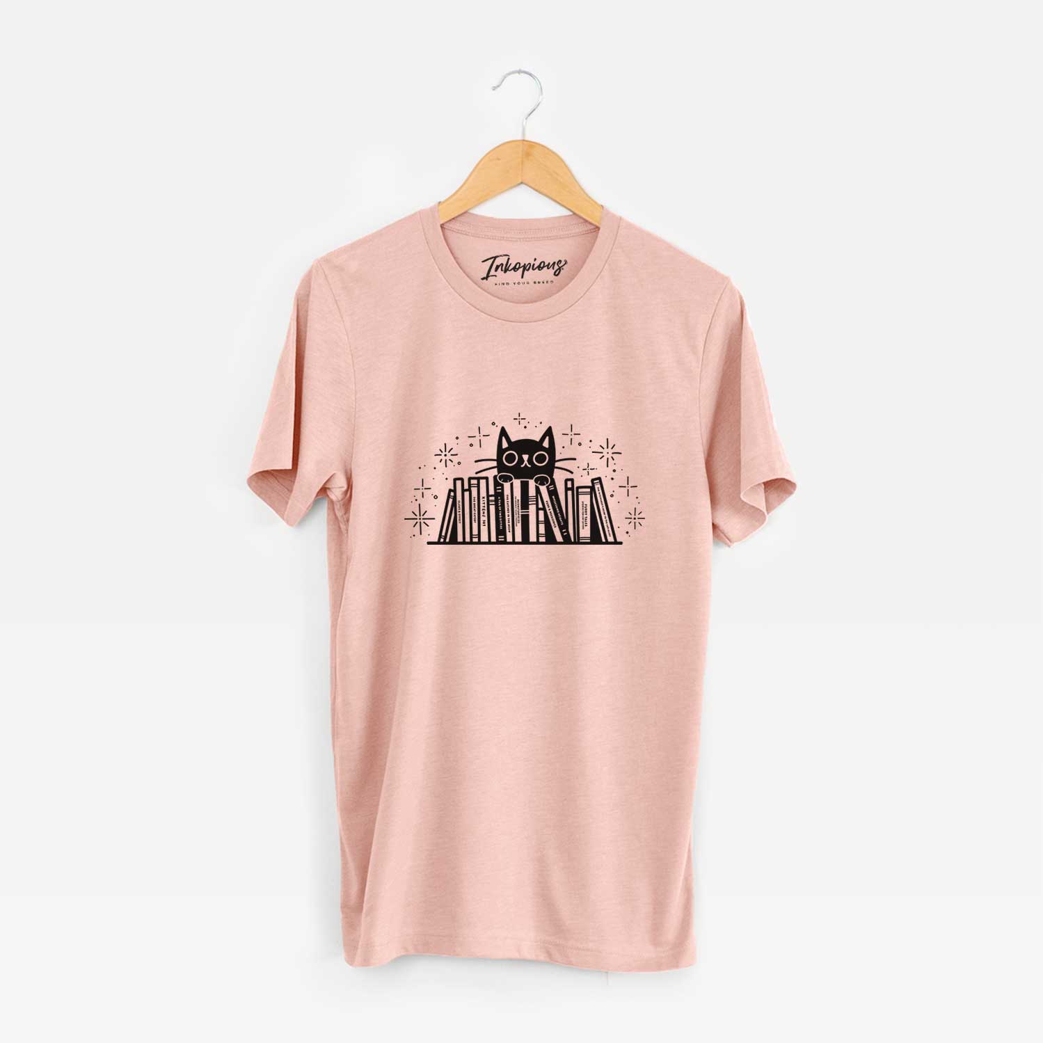 'Kitty Library - Black Cat Behind Books' design on a Peach Unisex crewneck