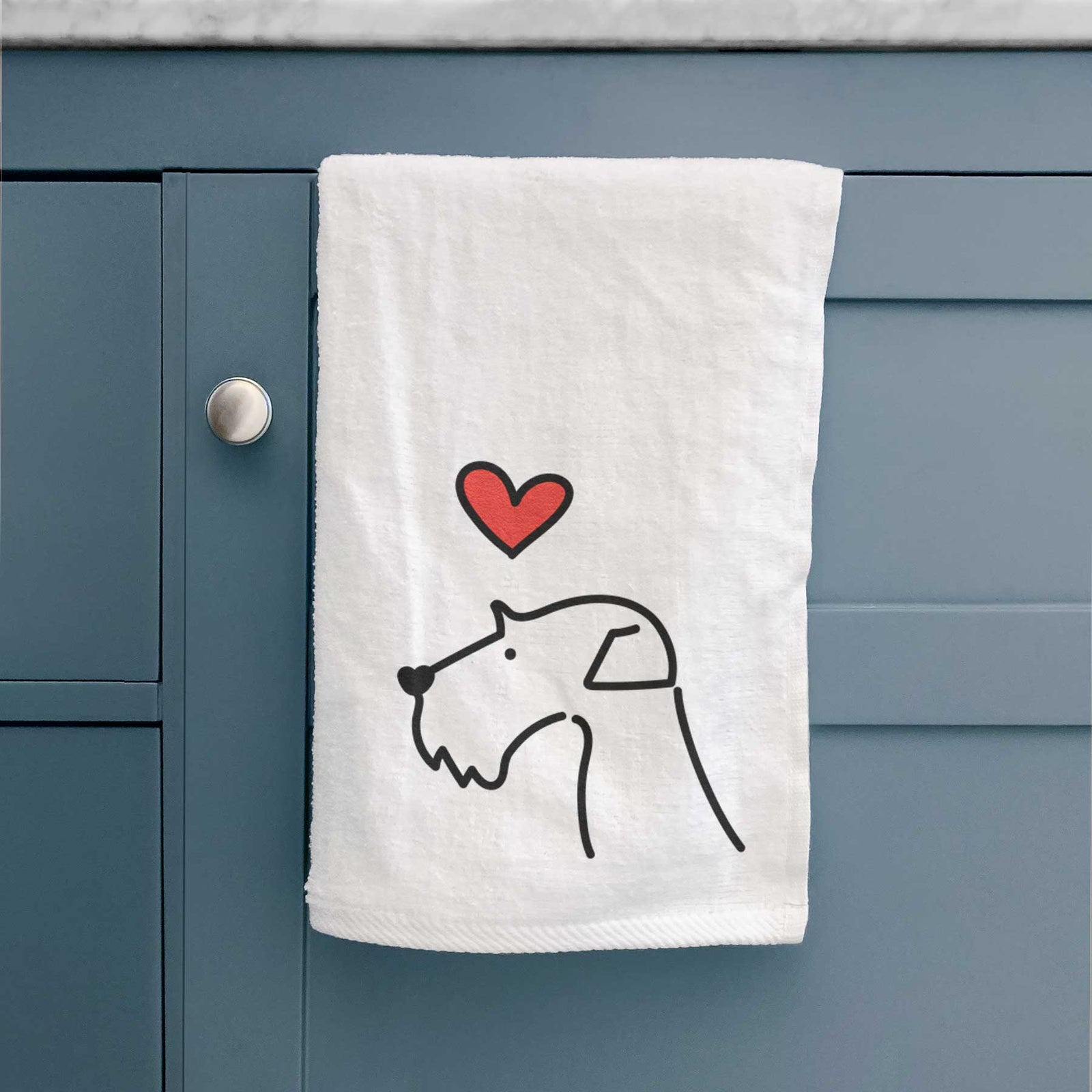 Minimalist line drawing of an Airedale Terrier with a red heart on a decorative hand towel
