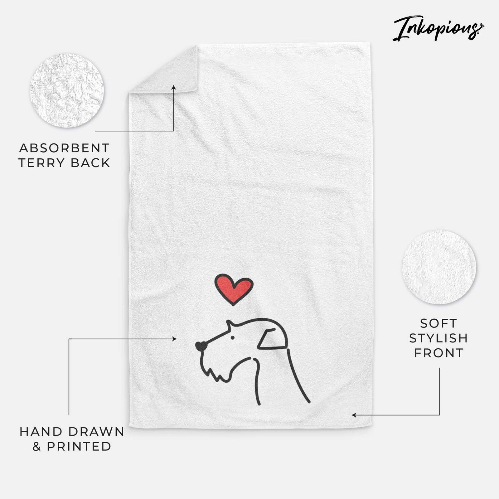Minimalist line drawing of an Airedale Terrier with a red heart on a decorative hand towel