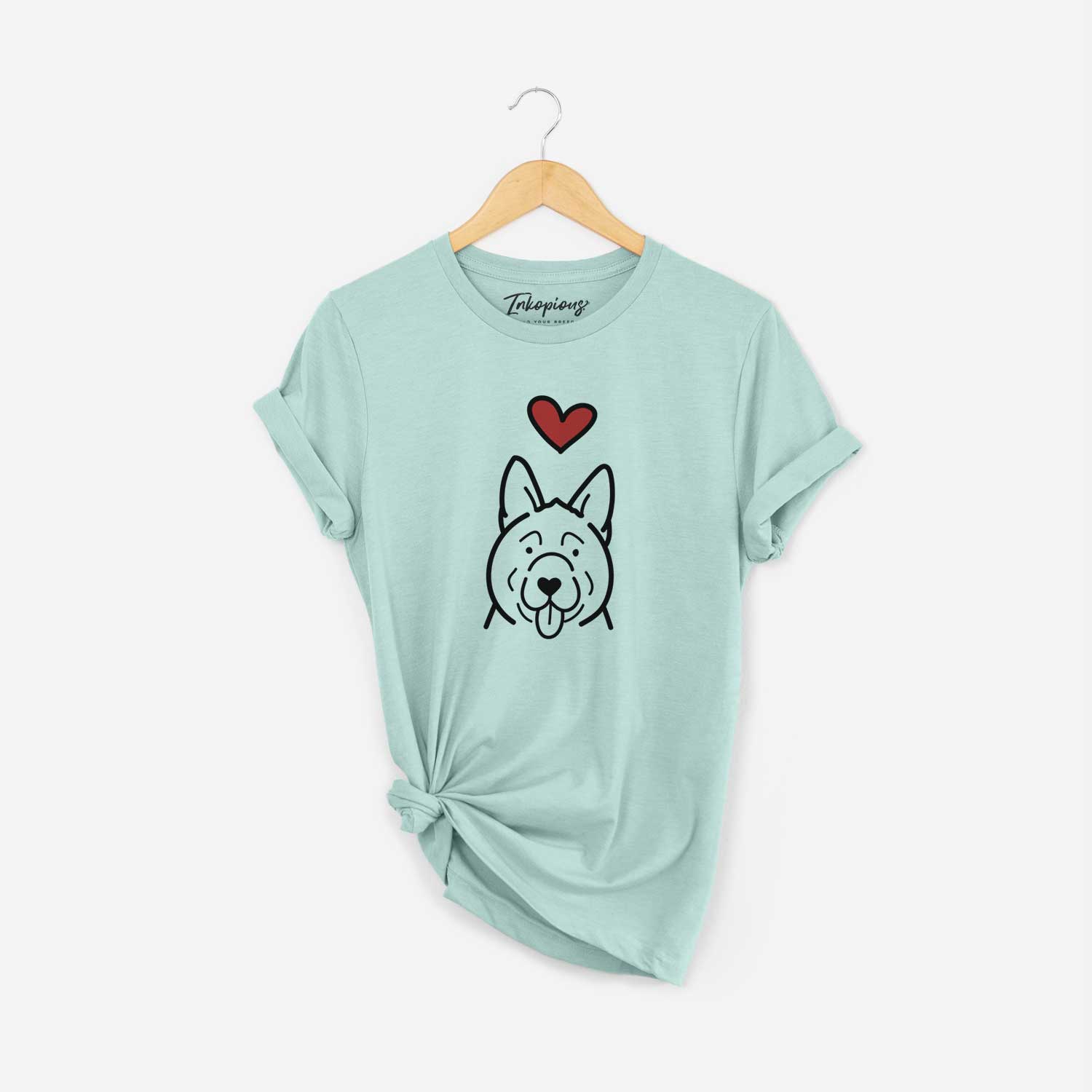 Minimalist line drawing of an Akita with a red heart on a Heather Sage Unisex crewneck
