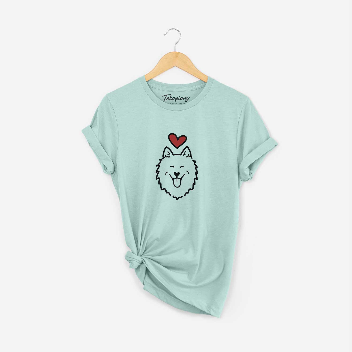 Minimalist line drawing of an American Eskimo with a red heart on a Heather Sage Unisex crewneck