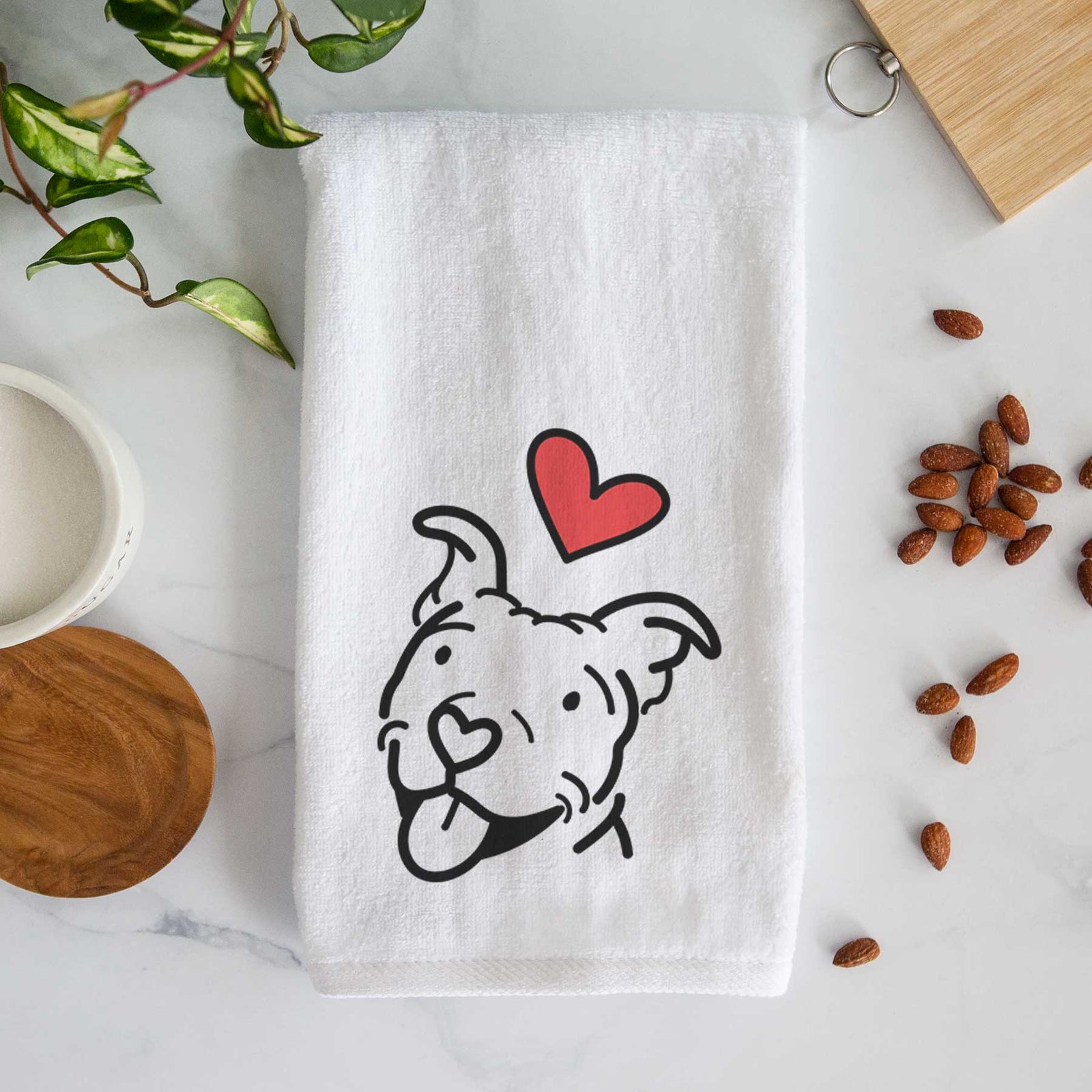 Minimalist line drawing of Arlo the Pitbull with a red heart on a decorative hand towel
