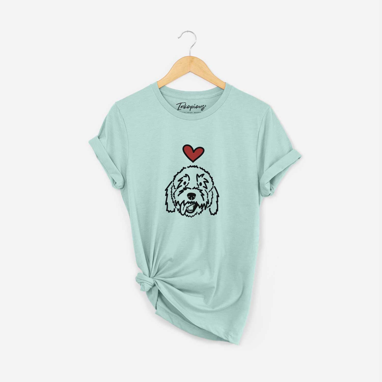 Minimalist line drawing of Barry the Goldendoodle with a red heart on a Heather Sage Unisex crewneck
