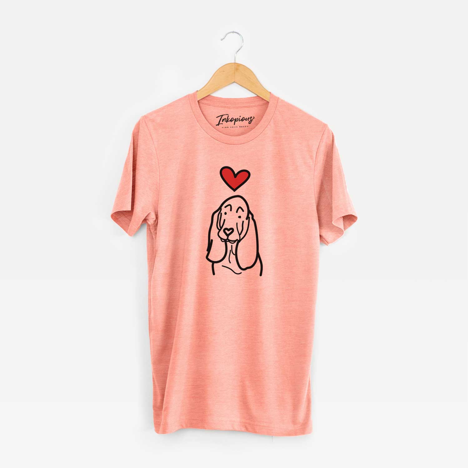 Minimalist line drawing of a Basset Hound with a red heart on a Sunset Unisex crewneck