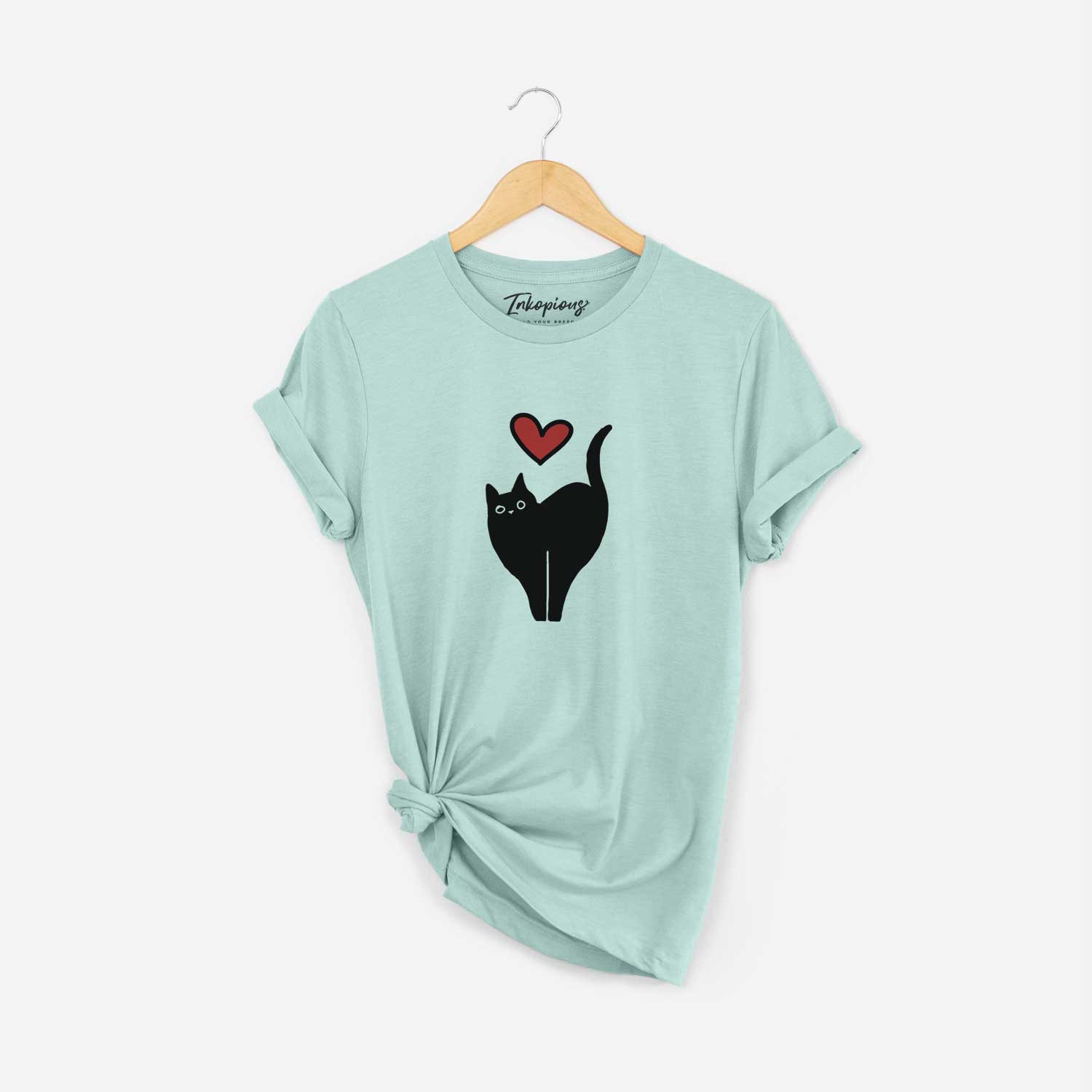 Minimalist line drawing of Bella the Black Cat with a red heart on a Heather Sage Unisex crewneck