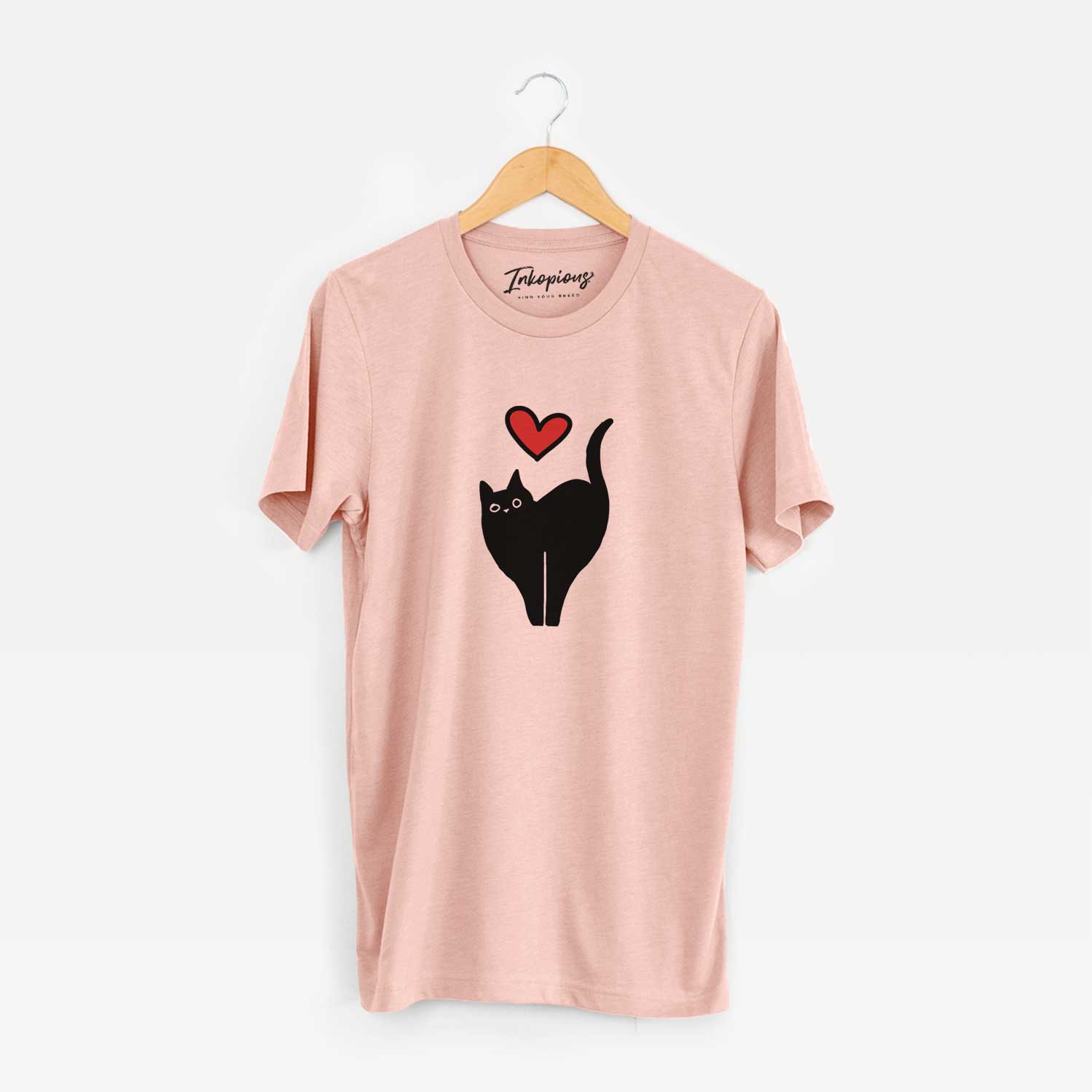 Minimalist line drawing of Bella the Black Cat with a red heart on a Peach Unisex crewneck