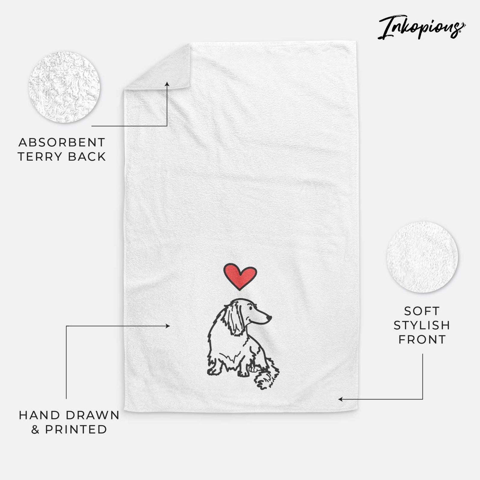 Minimalist line drawing of Bella the Dachshund with a red heart on a decorative hand towel