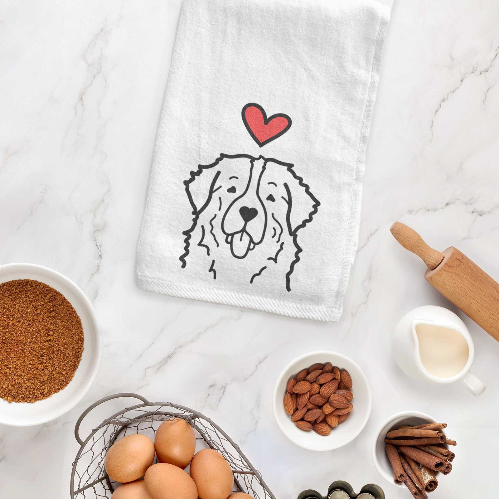 Minimalist line drawing of a Bernese Mountain Dog with a red heart on a decorative hand towel