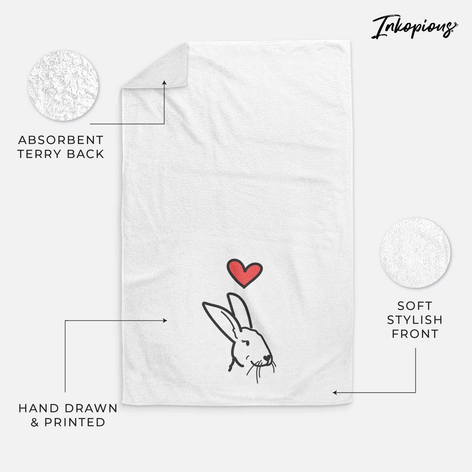 Minimalist line drawing of Betsy the Rex Rabbit with a red heart on a decorative hand towel