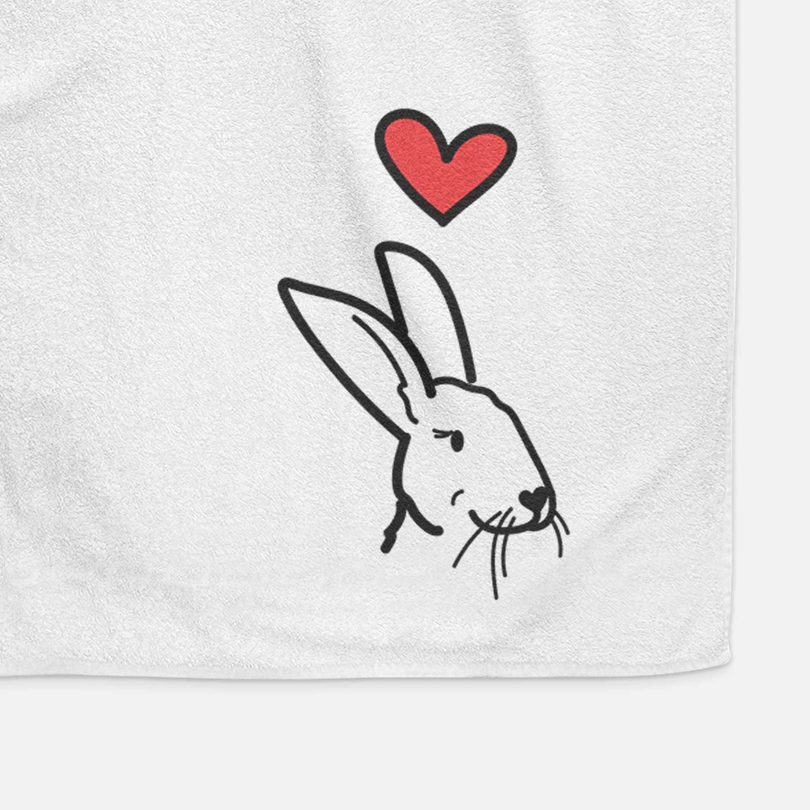 Minimalist line drawing of Betsy the Rex Rabbit with a red heart on a decorative hand towel