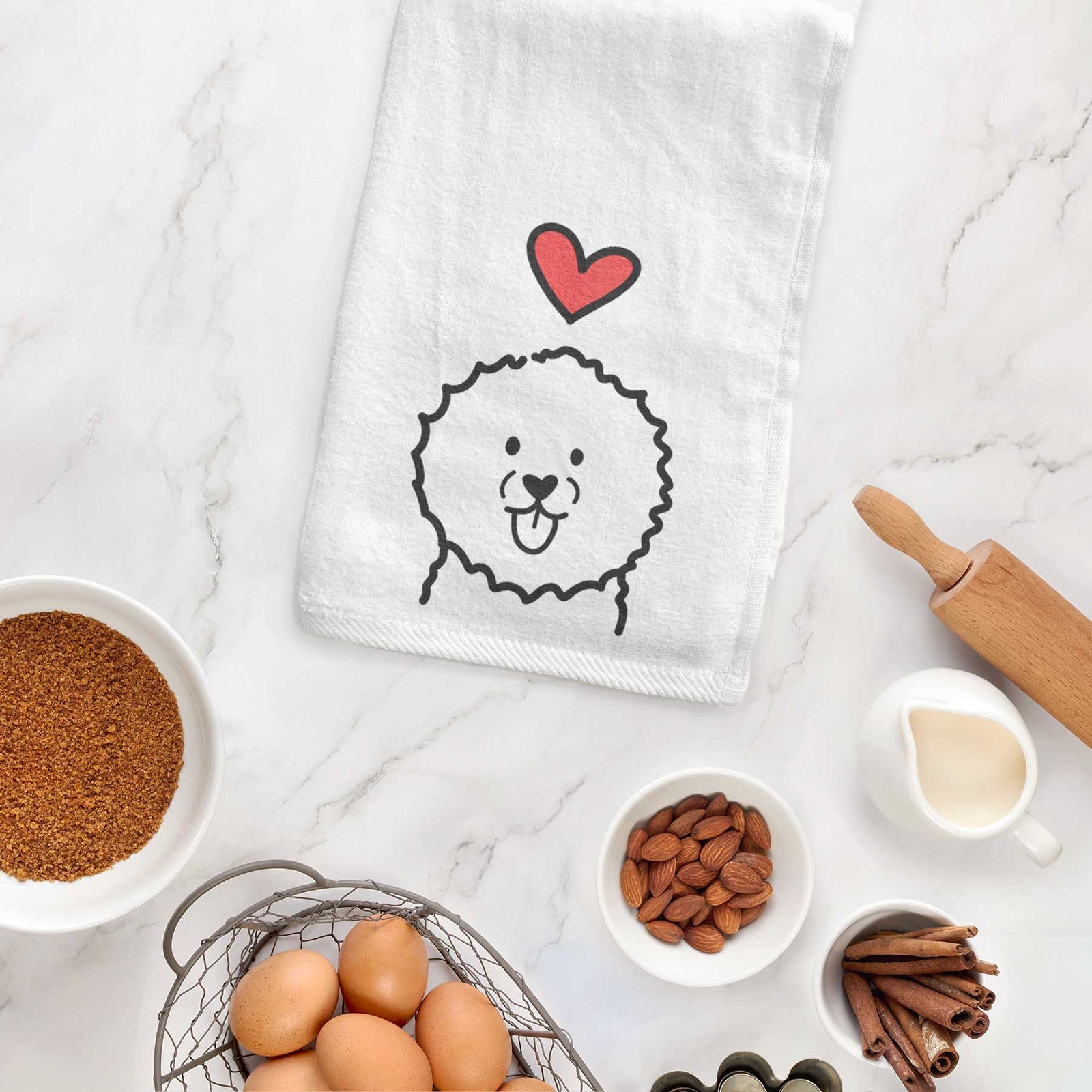 Minimalist line drawing of a Bichon Frise with a red heart on a decorative hand towel