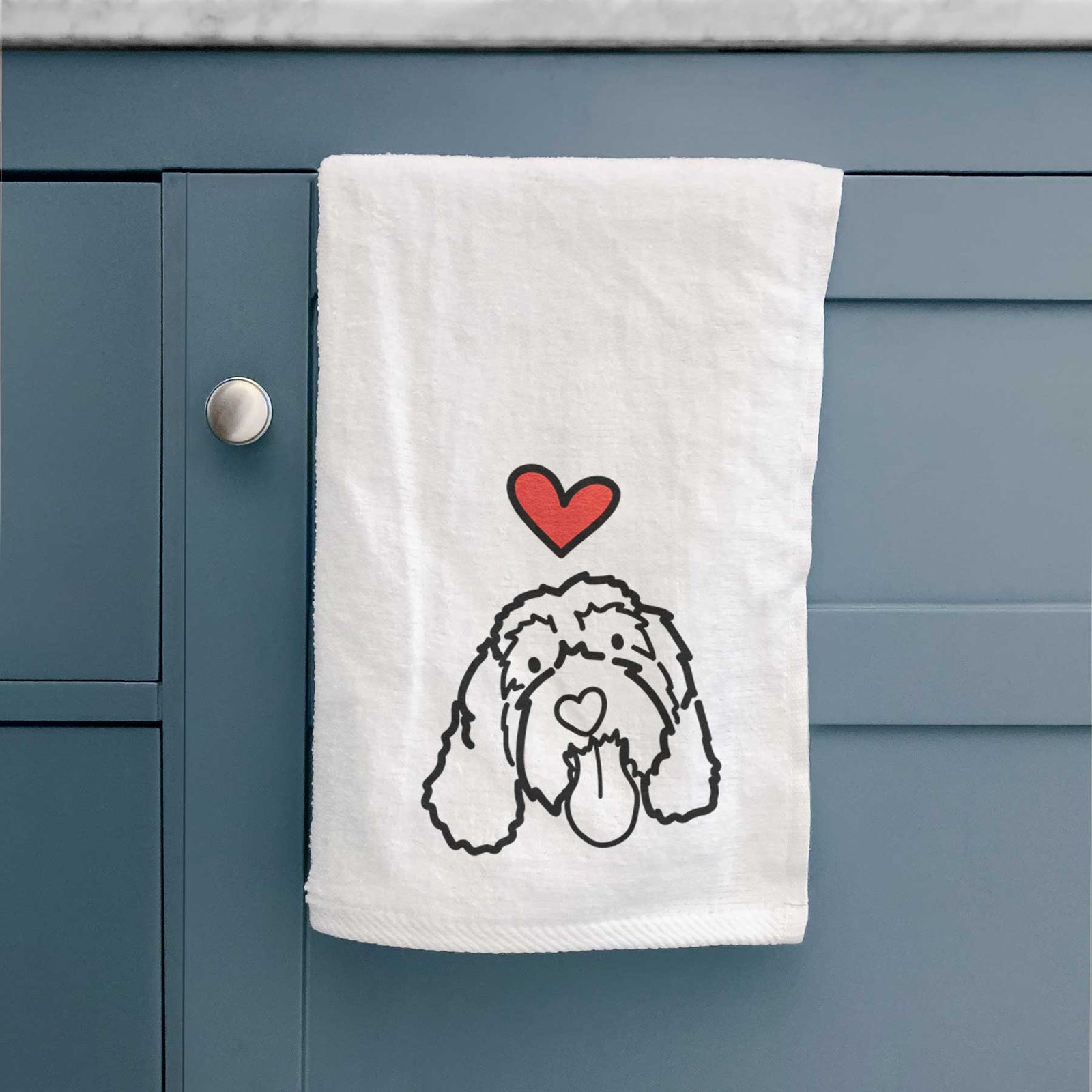 Minimalist line drawing of Bo the Portguese Water Dog with a red heart on a decorative hand towel