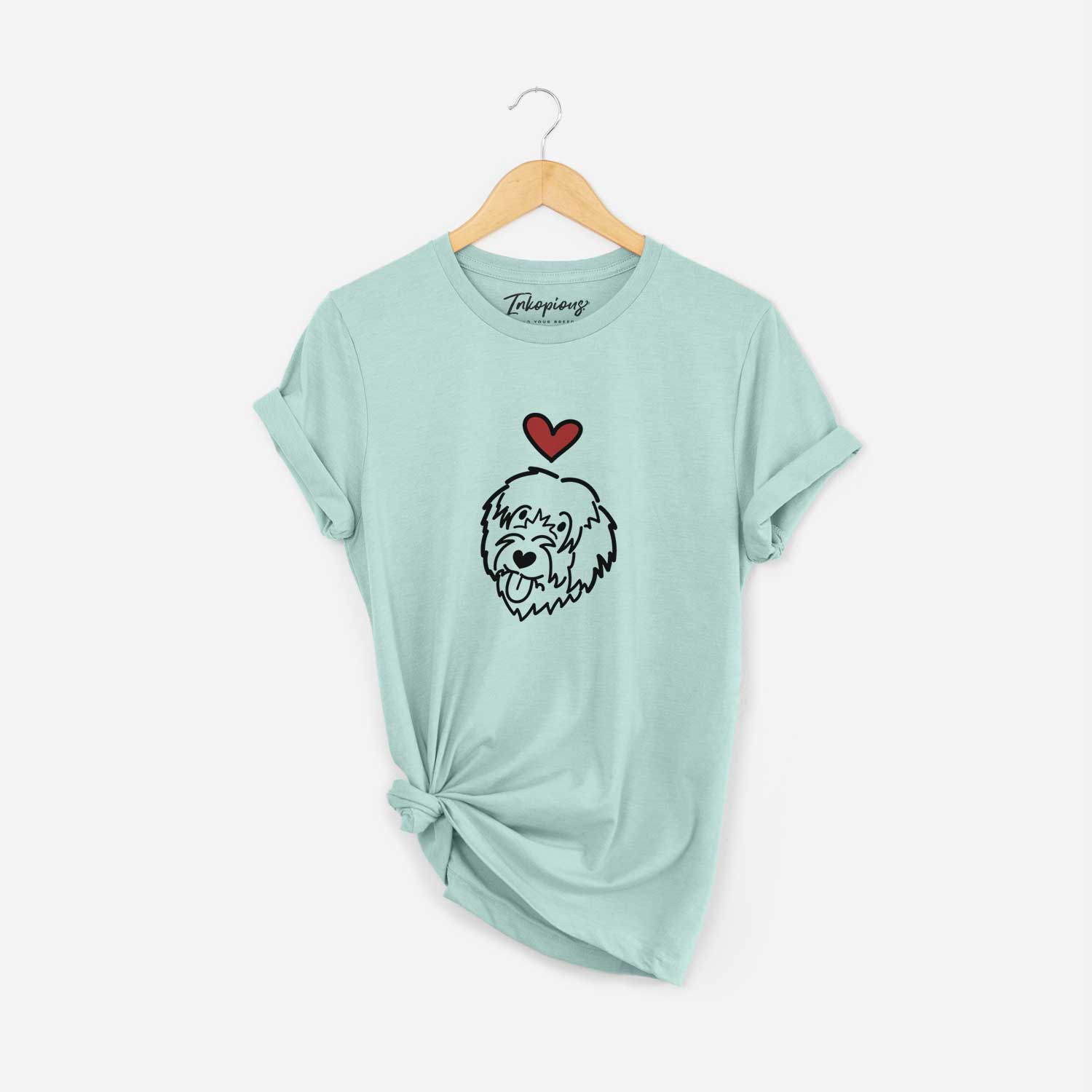 Minimalist line drawing of a Catalan Sheepdog with a red heart on a Heather Sage Unisex crewneck