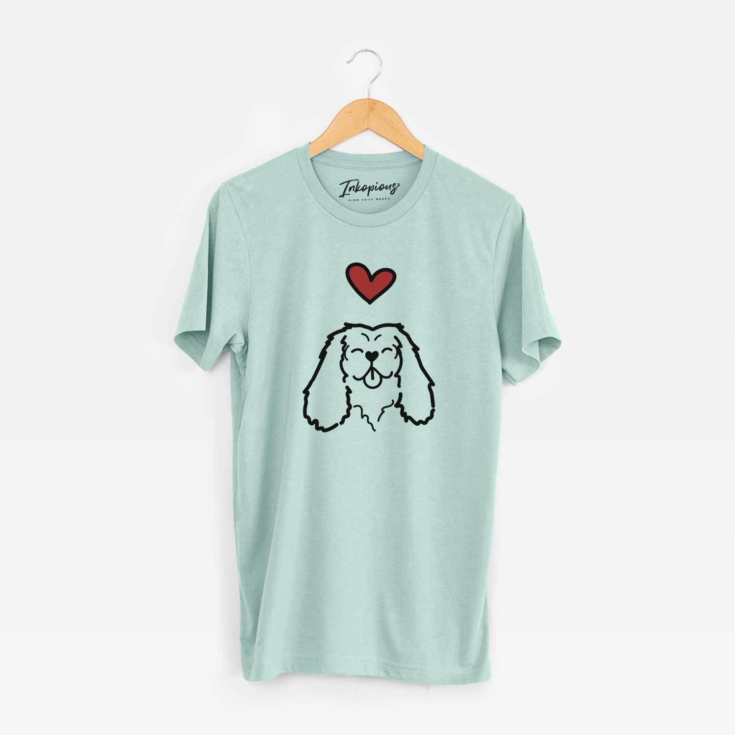 Minimalist line drawing of a Cavalier King Charles Spaniel with a red heart on a Heather Sage Unisex crewneck