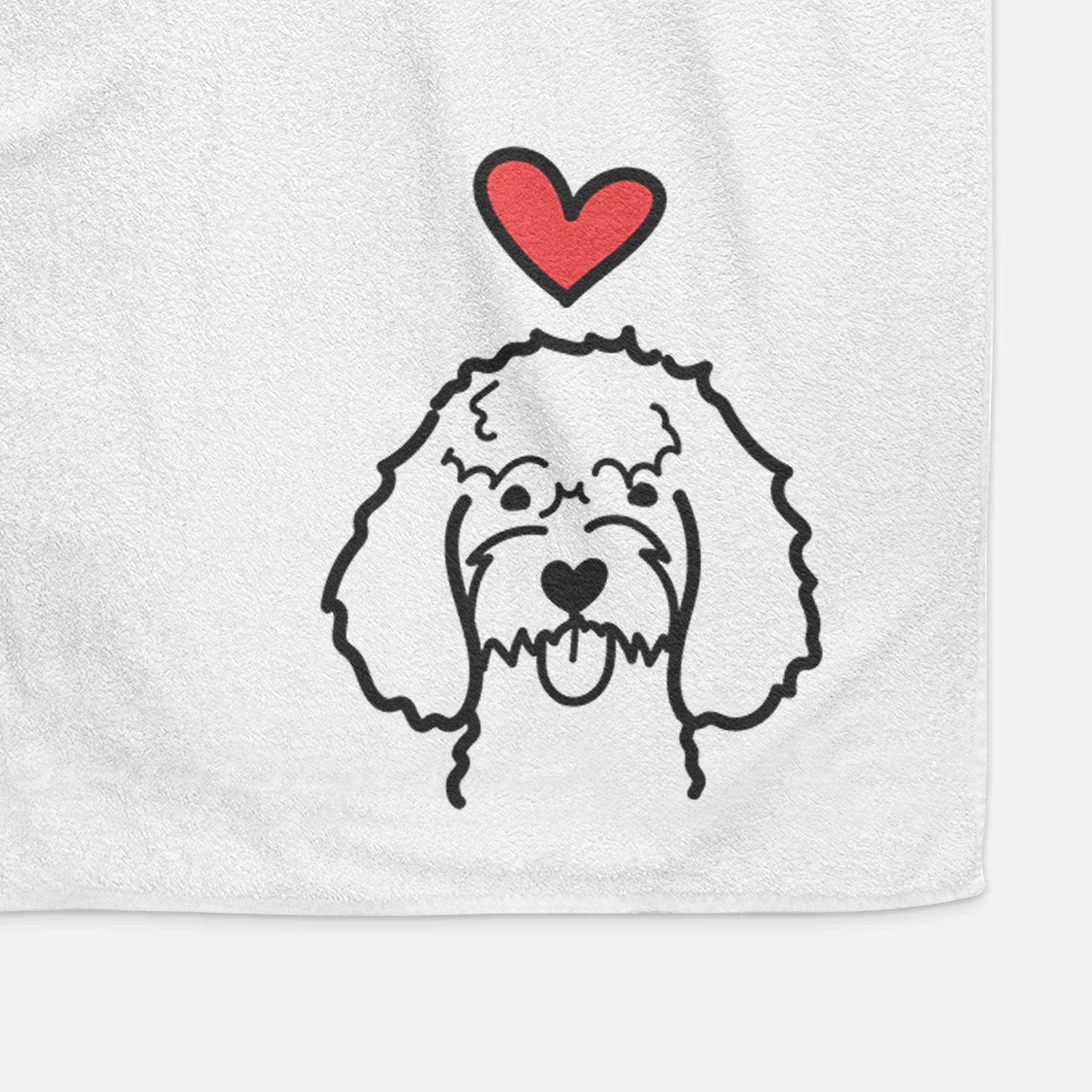 Minimalist line drawing of a Cockapoo with a red heart on a decorative hand towel