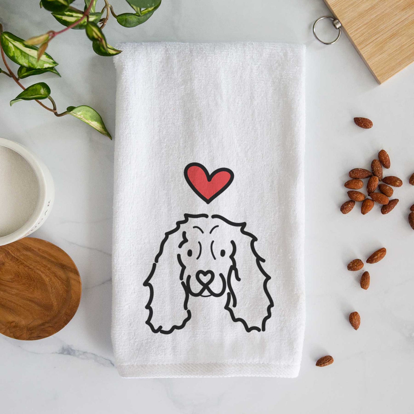 Minimalist line drawing of an American Cocker Spaniel with a red heart on a decorative hand towel