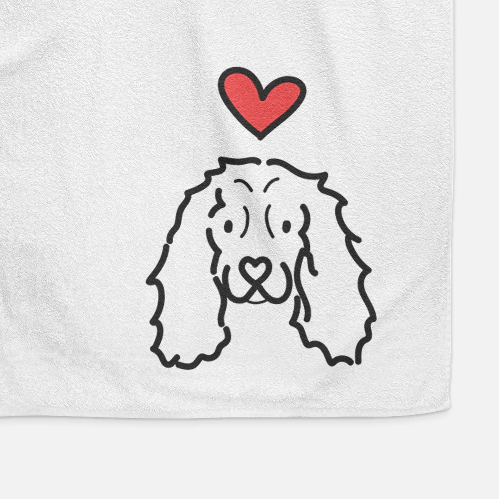 Minimalist line drawing of an American Cocker Spaniel with a red heart on a decorative hand towel