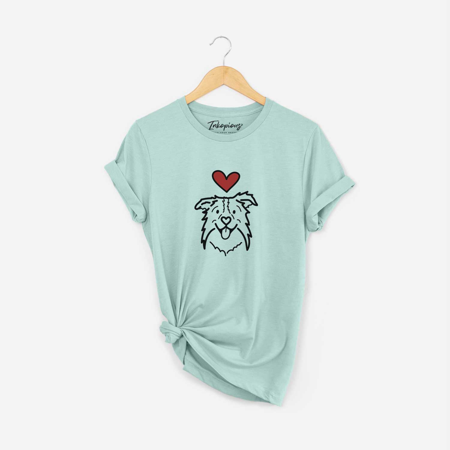 Minimalist line drawing of Cricket the Border Collie with a red heart on a Heather Sage Unisex crewneck