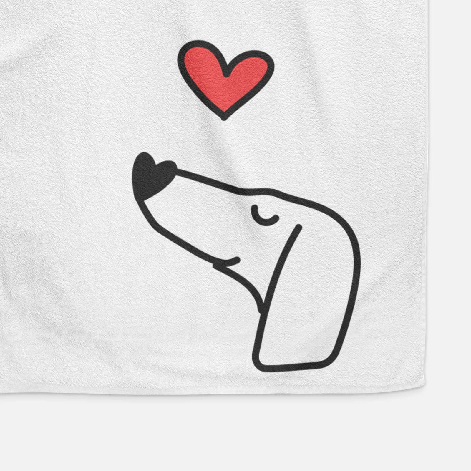 Minimalist line drawing of a Dachshund with a red heart on a decorative hand towel