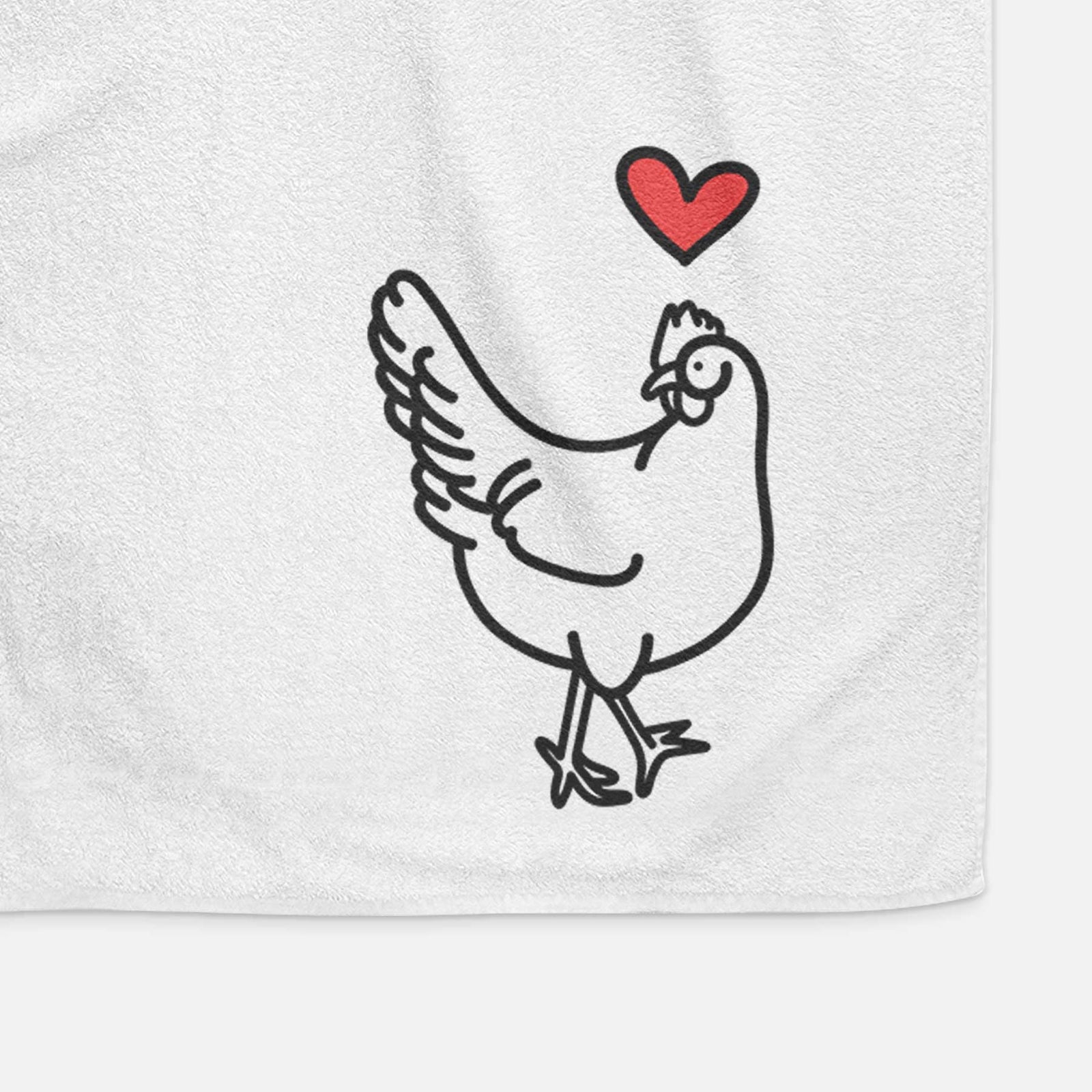 Minimalist line drawing of Daisy the Chicken with a red heart on a decorative hand towel