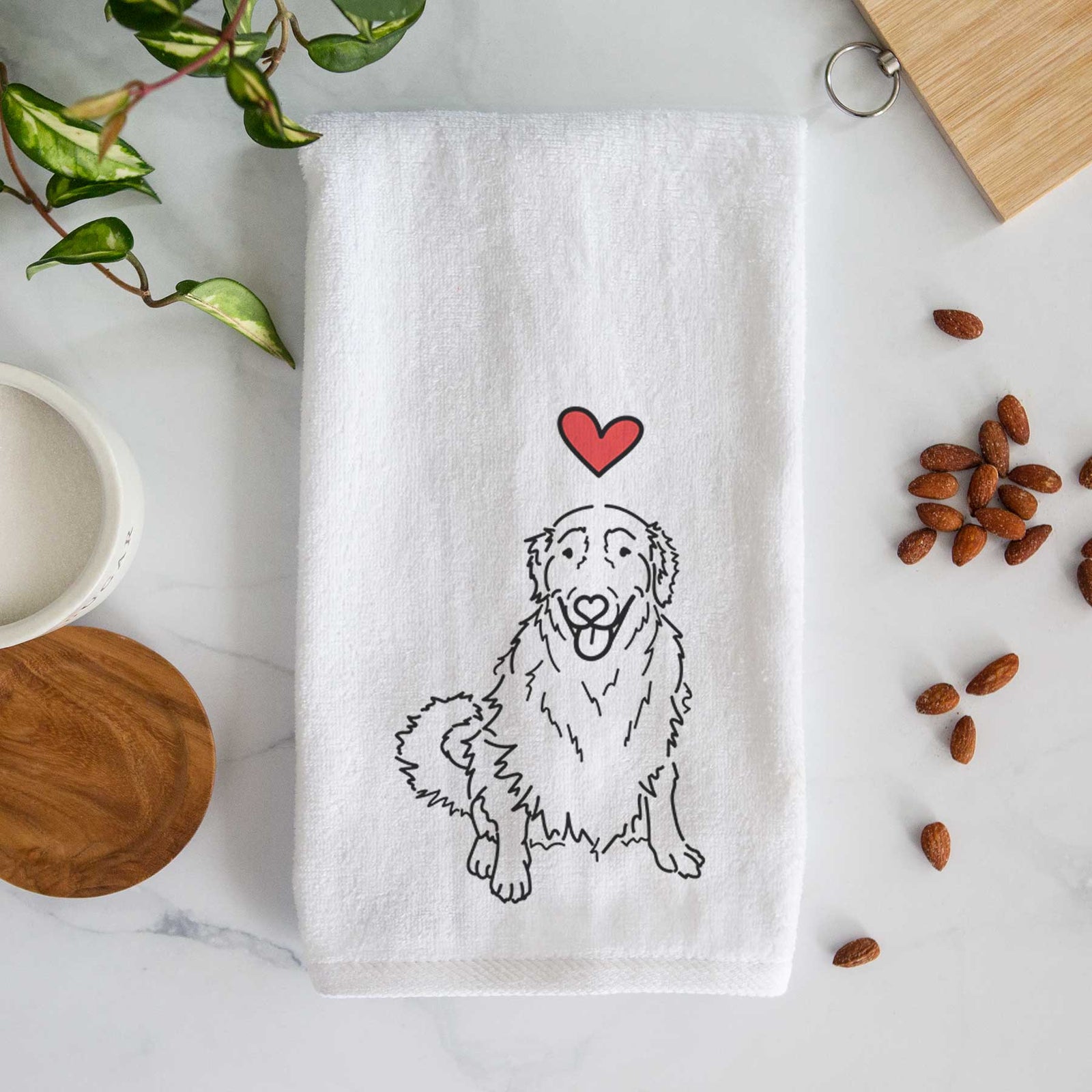 Minimalist line drawing of Daisy the Golden Retriever with a red heart on a decorative hand towel