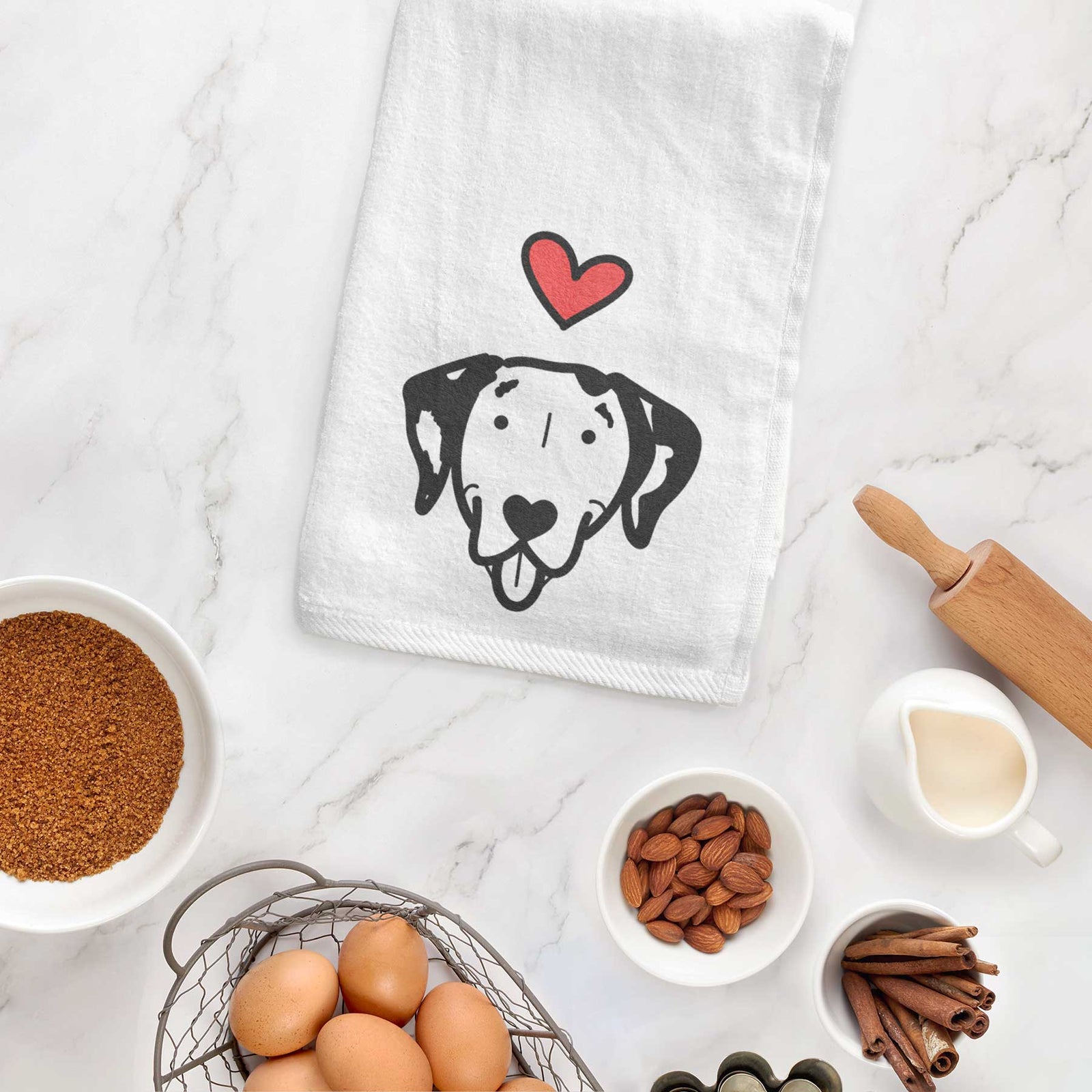 Minimalist line drawing of a Dalmatian with a red heart on a decorative hand towel