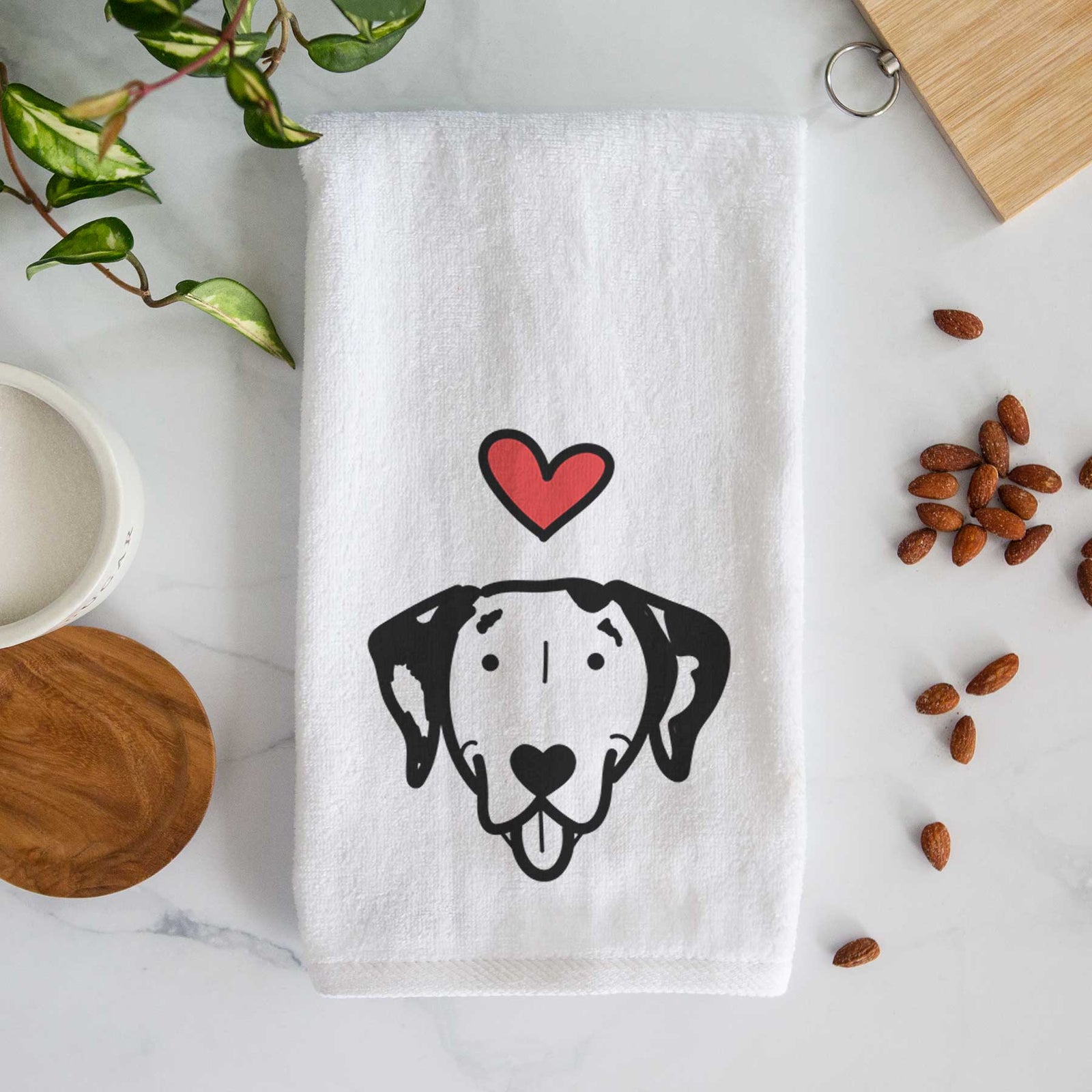 Minimalist line drawing of a Dalmatian with a red heart on a decorative hand towel