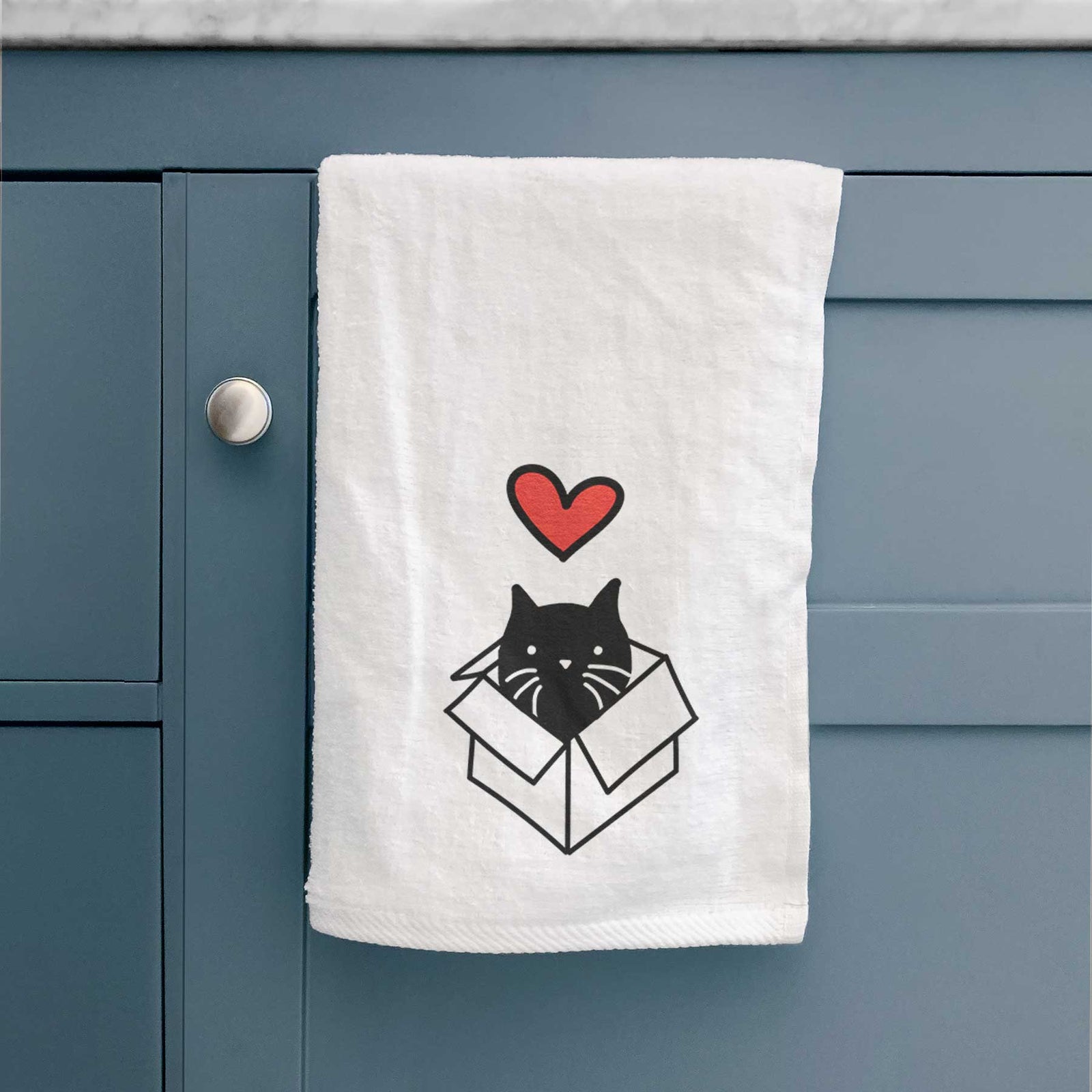 Minimalist line drawing of Doc the Black Cat in a Box with a red heart on a decorative hand towel