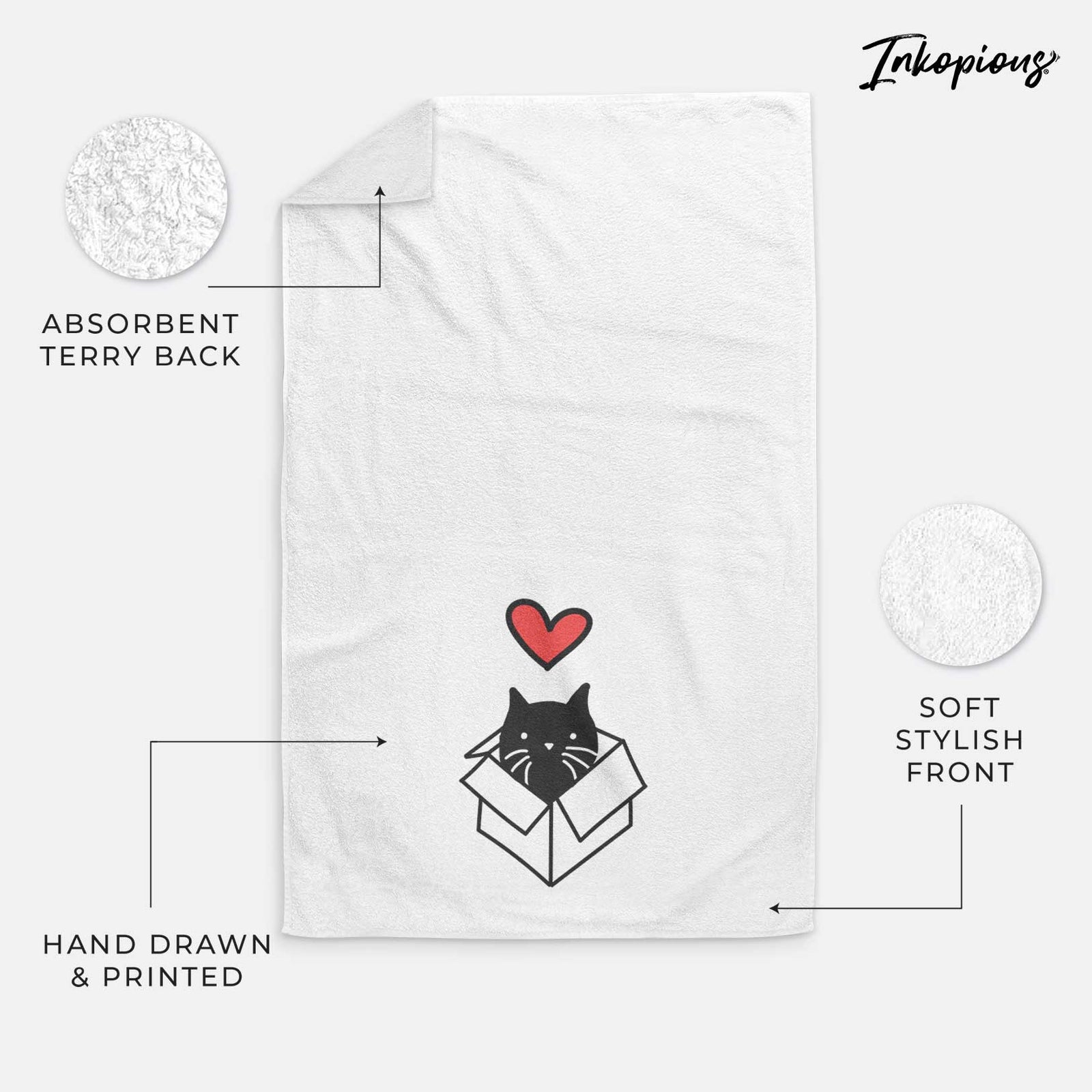 Minimalist line drawing of Doc the Black Cat in a Box with a red heart on a decorative hand towel