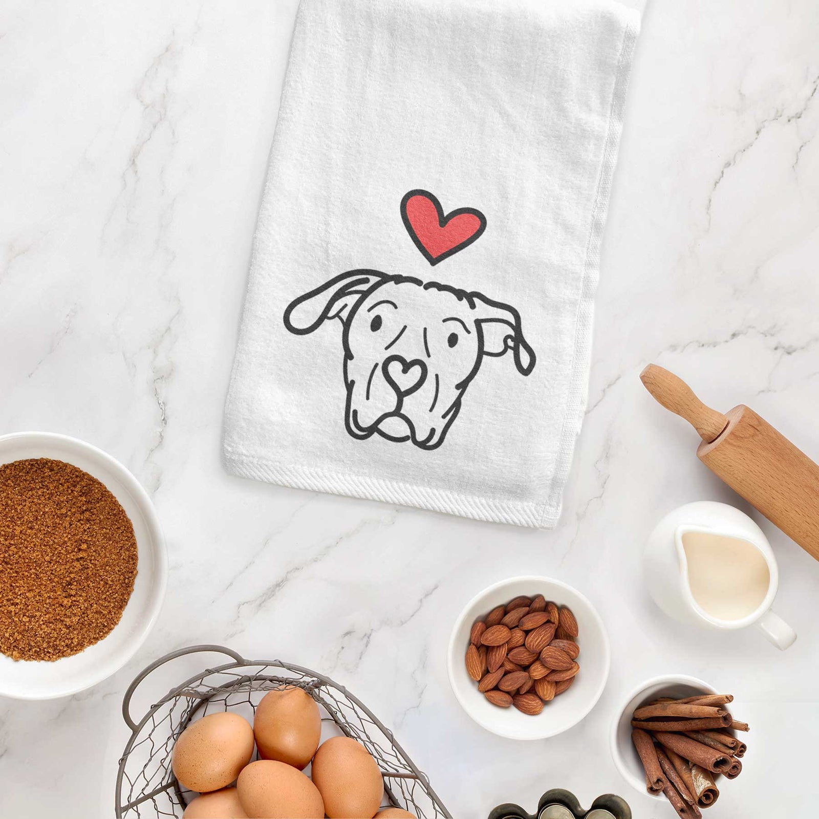 Minimalist line drawing of Genevieve the Dogo Argentino with a red heart on a decorative hand towel