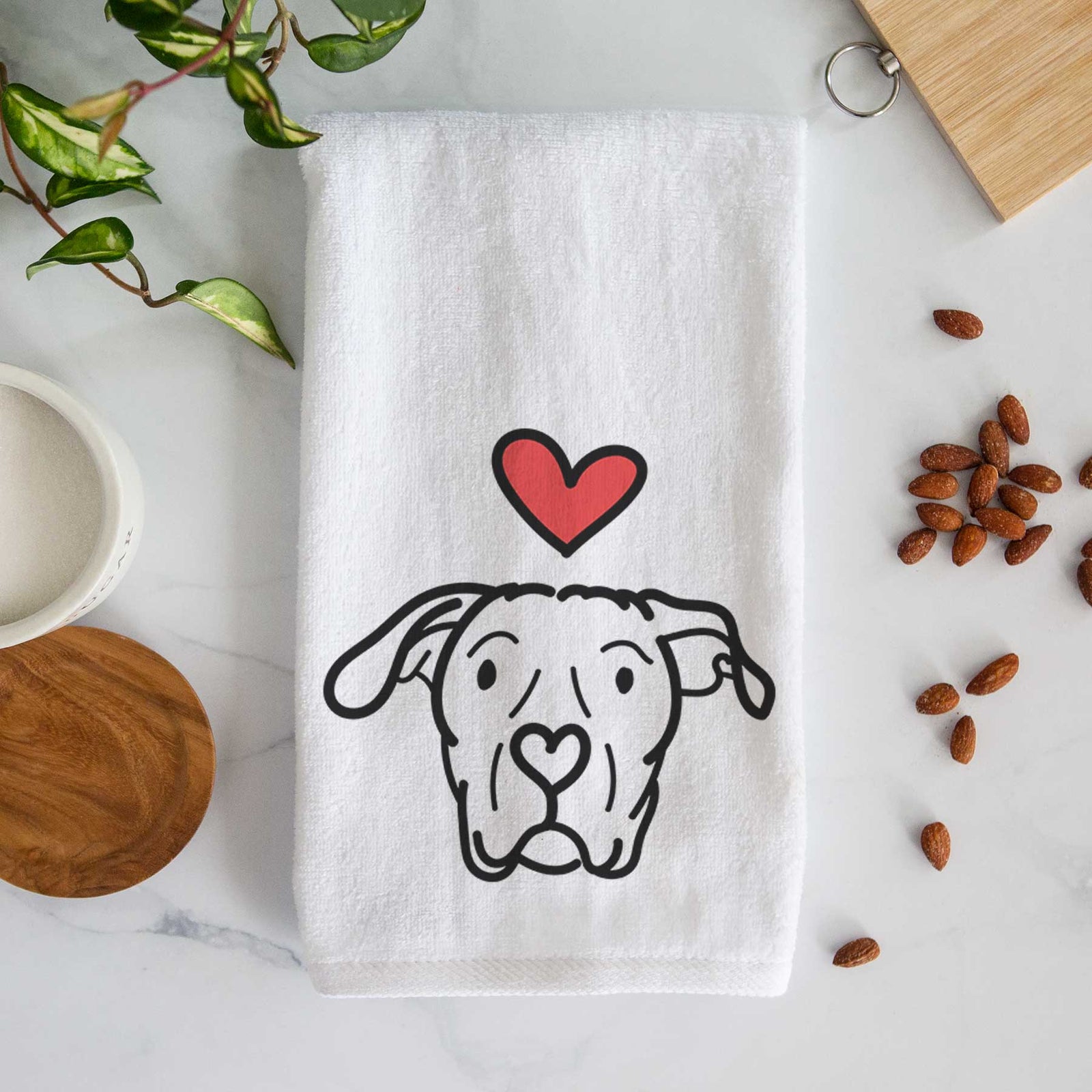 Minimalist line drawing of Genevieve the Dogo Argentino with a red heart on a decorative hand towel