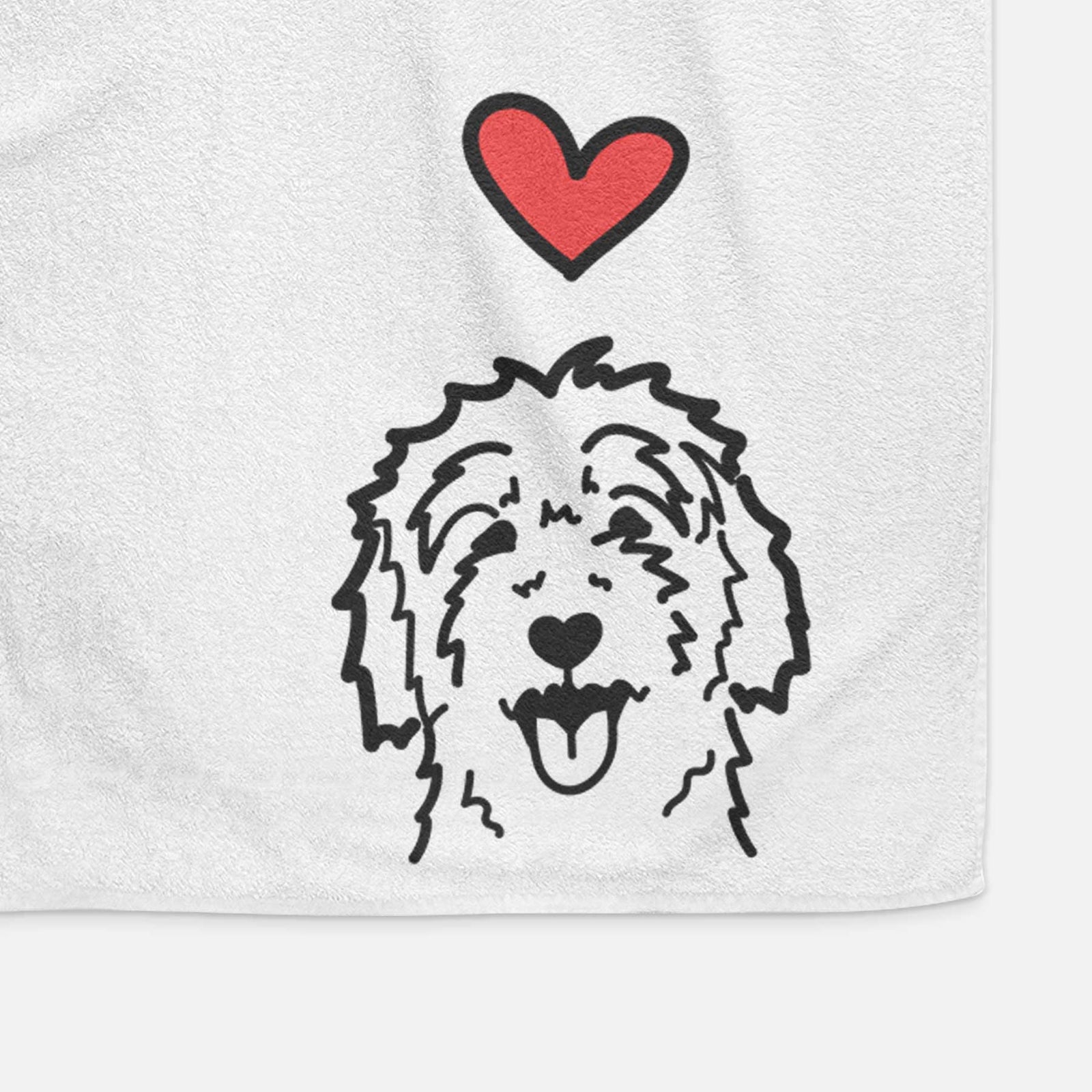 Minimalist line drawing of a Goldendoodle with a red heart on a decorative hand towel