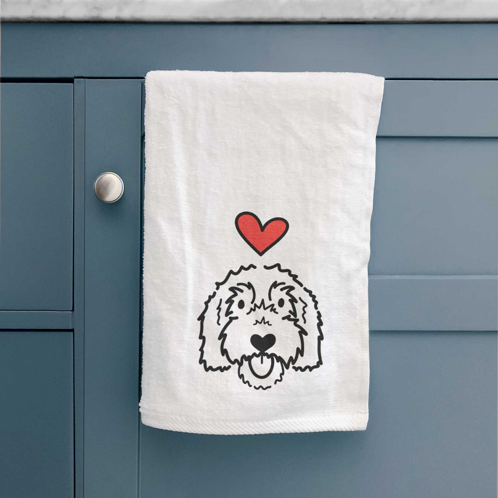 Minimalist line drawing of Gus the Goldendoodle with a red heart on a decorative hand towel