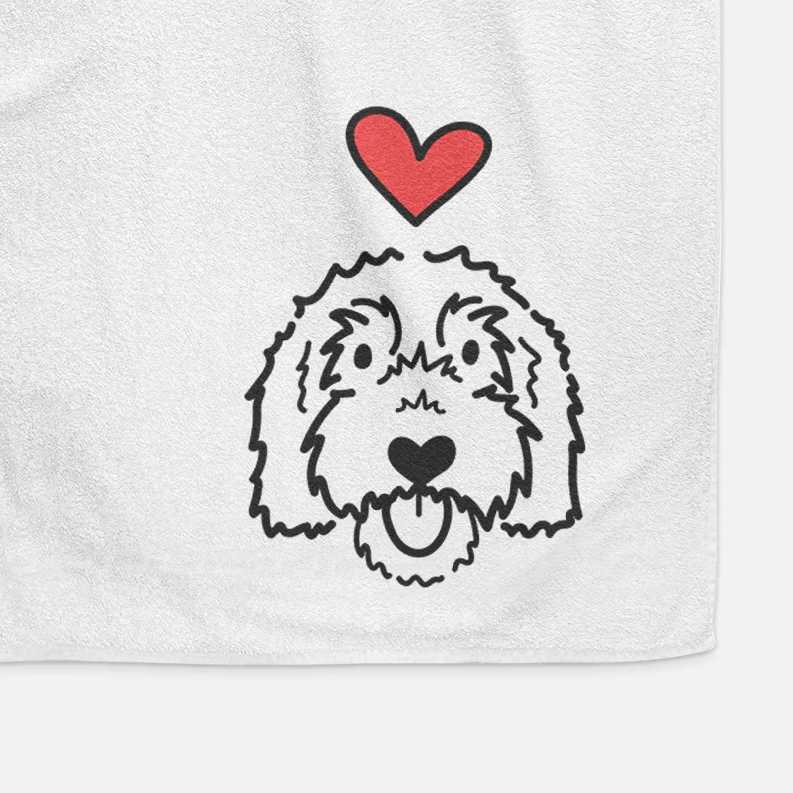 Minimalist line drawing of Gus the Goldendoodle with a red heart on a decorative hand towel