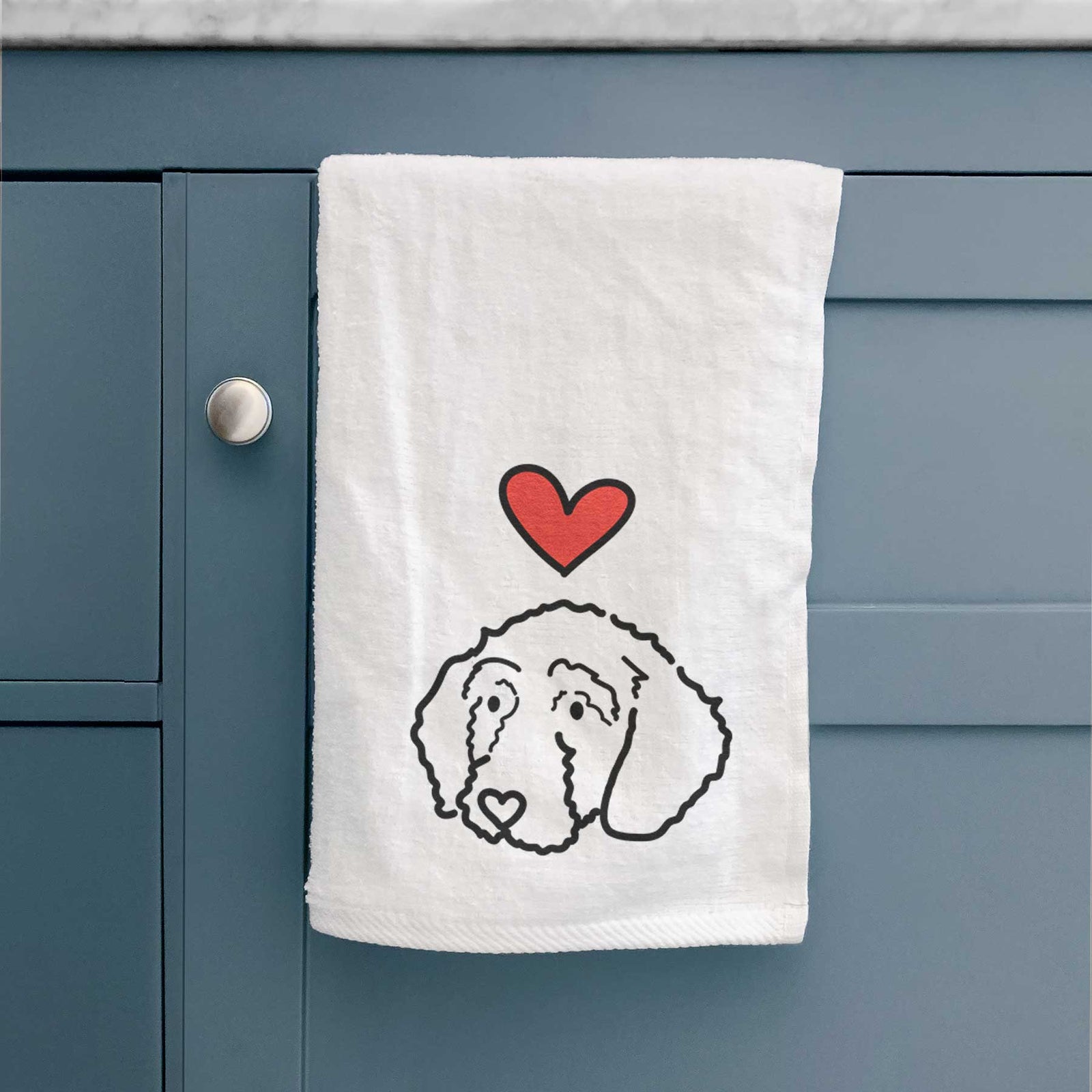Minimalist line drawing of Hanna the Goldendoodle with a red heart on a decorative hand towel