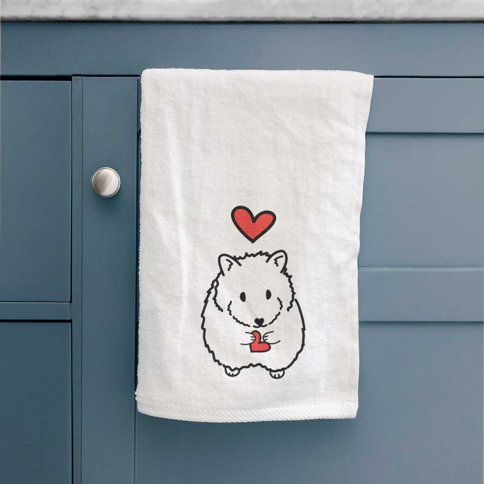 Minimalist line drawing of Hilga the Hamster with a red heart on a decorative hand towel