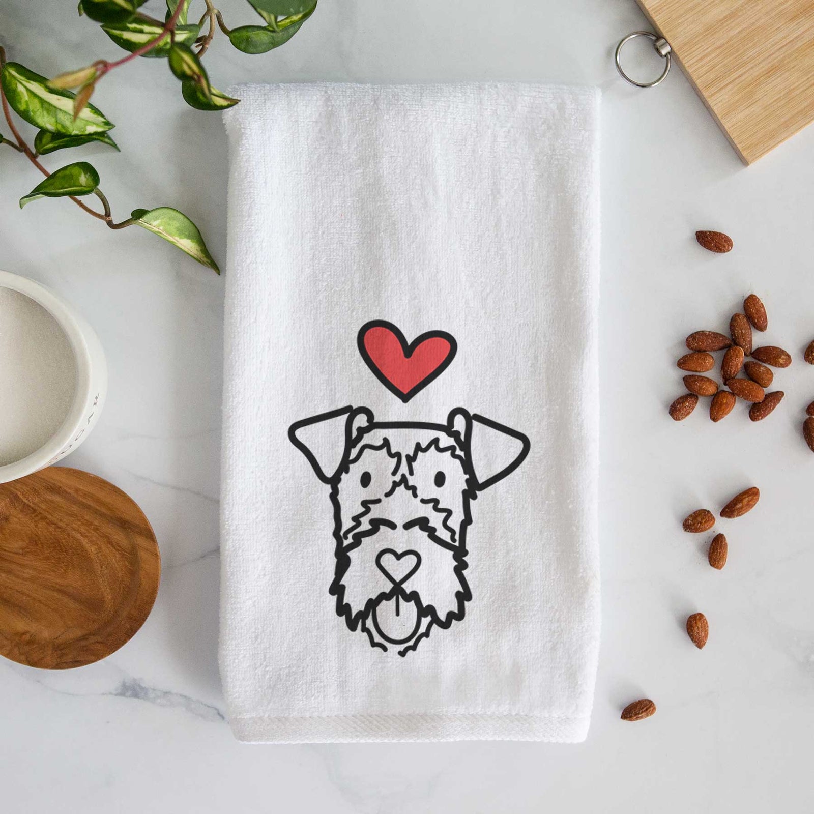 Minimalist line drawing of an Irish Terrier with a red heart on a decorative hand towel