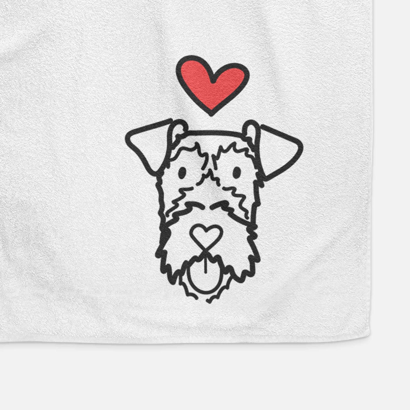 Minimalist line drawing of an Irish Terrier with a red heart on a decorative hand towel