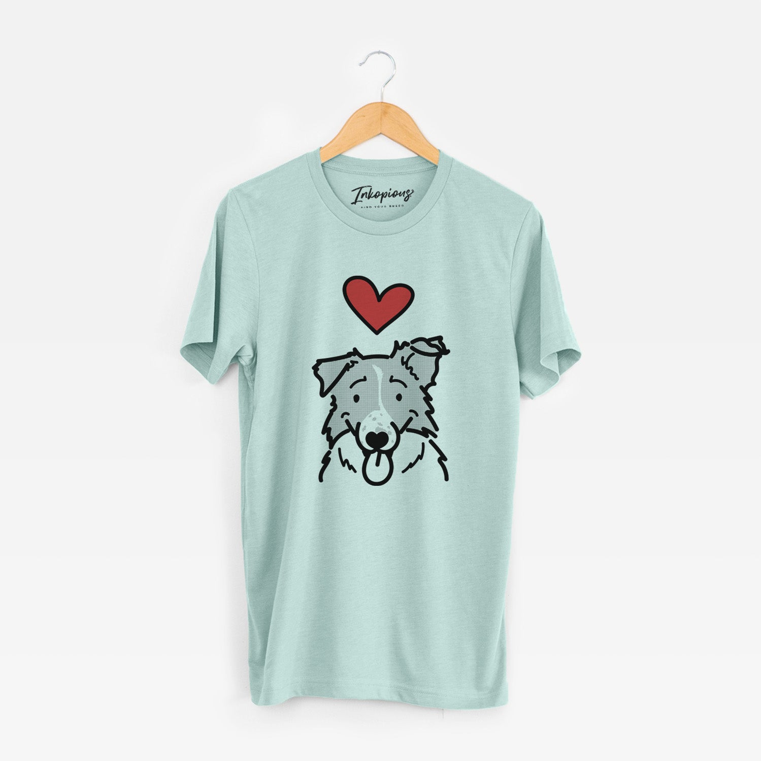 Minimalist line drawing of Jam the Border Collie with a red heart on a Heather Sage Unisex crewneck
