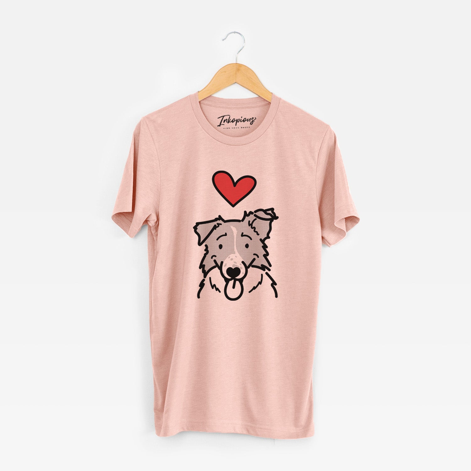 Minimalist line drawing of Jam the Border Collie with a red heart on a Peach Unisex crewneck
