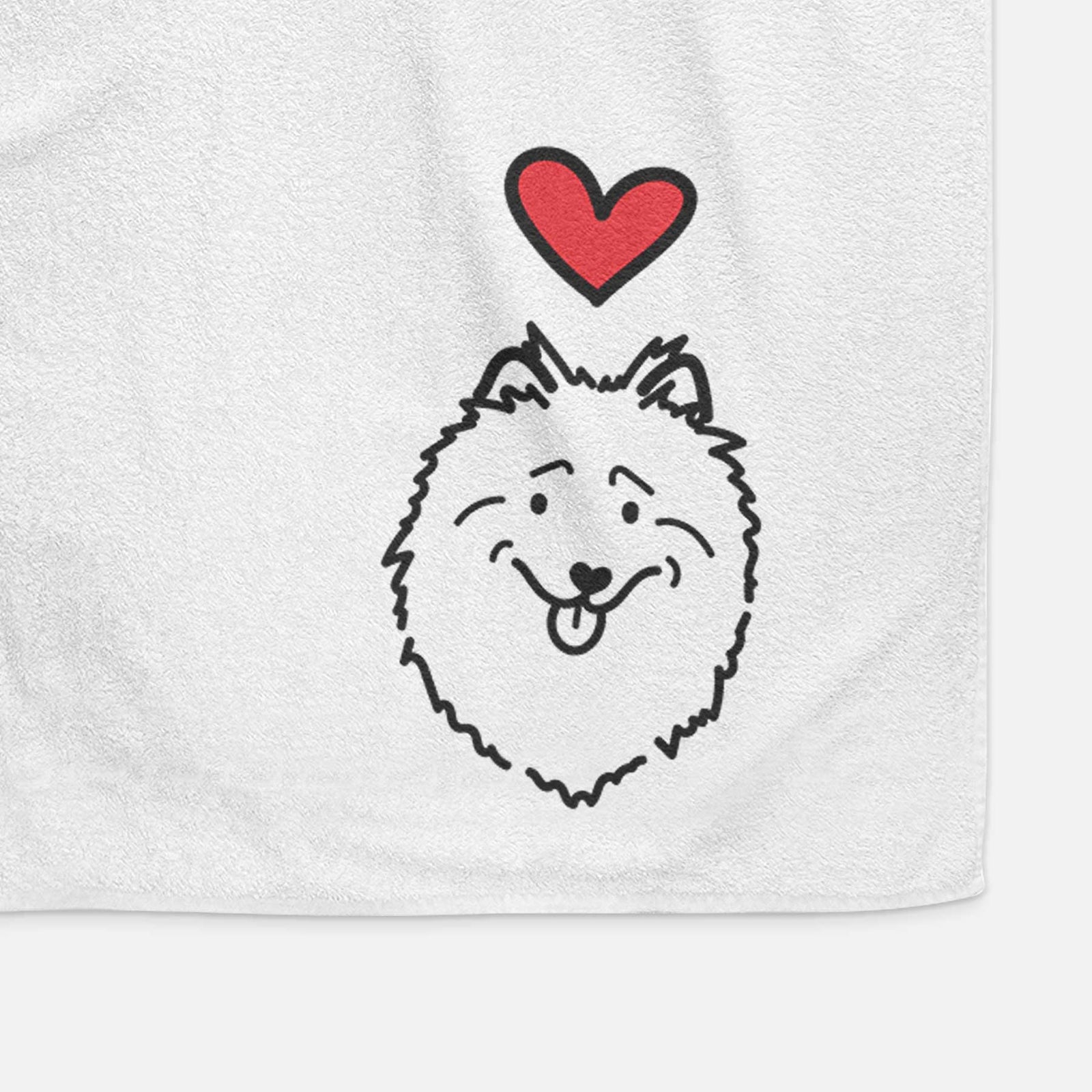 Minimalist line drawing of a Keeshond with a red heart on a decorative hand towel