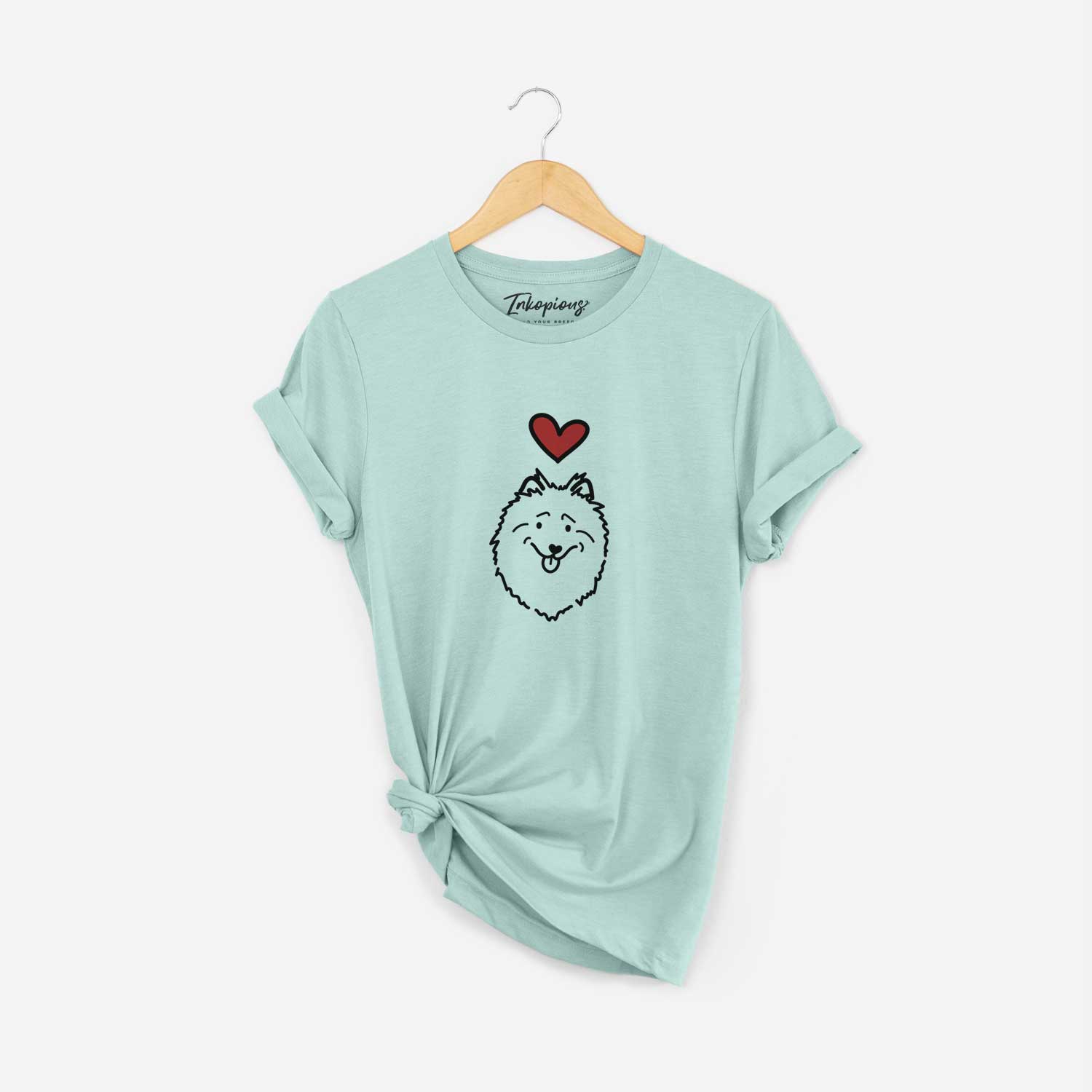 Minimalist line drawing of a Keeshond with a red heart on a Heather Sage Unisex crewneck