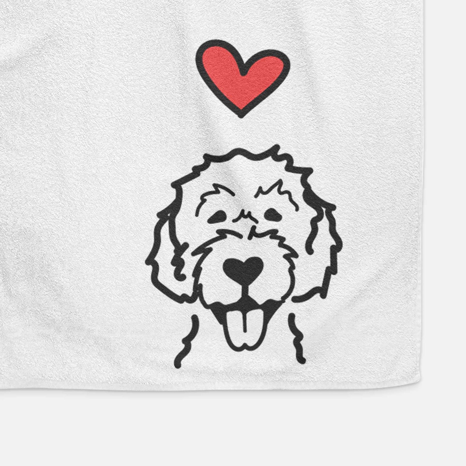 Minimalist line drawing of a Labradoodle with a red heart on a decorative hand towel
