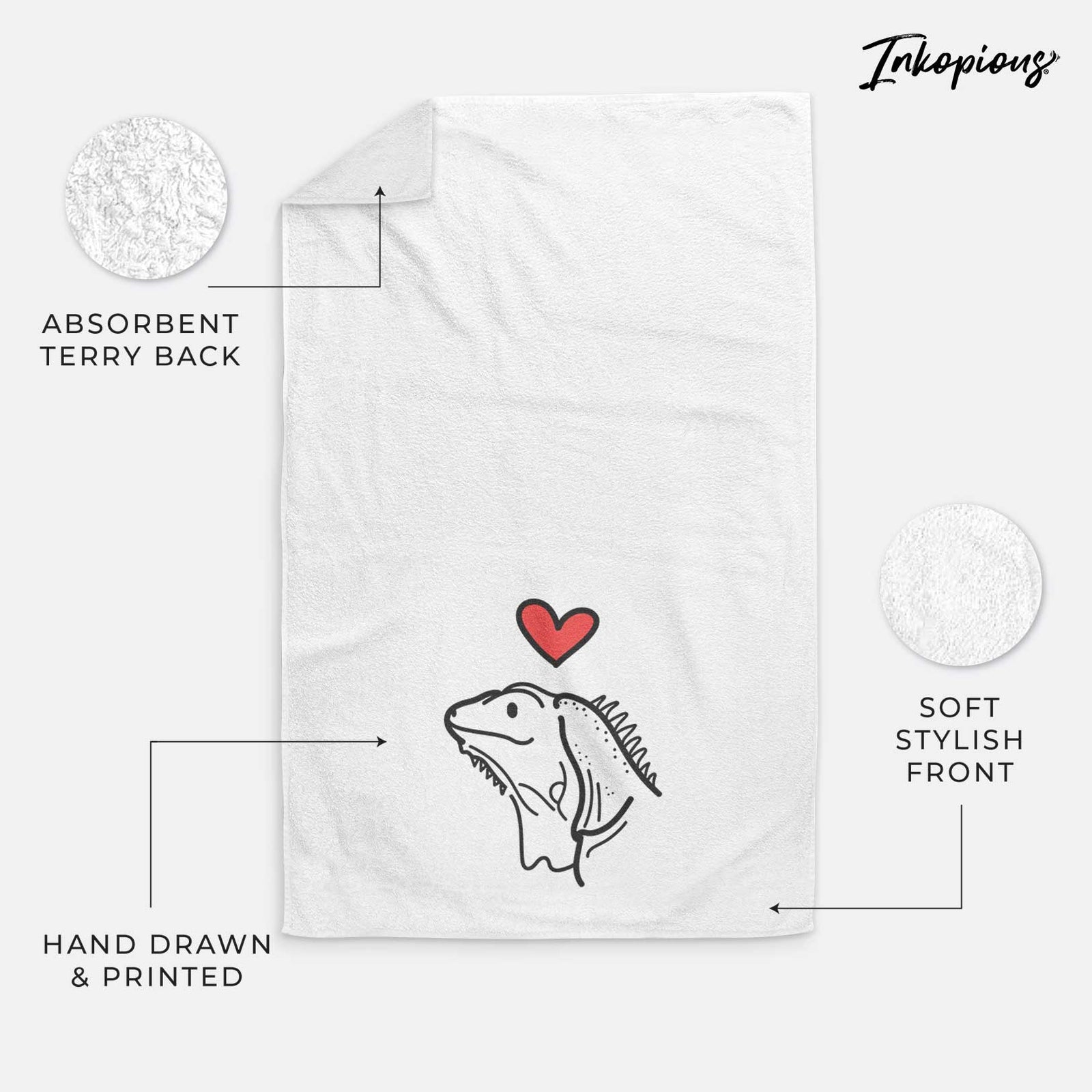 Minimalist line drawing of Louie the Iguana with a red heart on a decorative hand towel