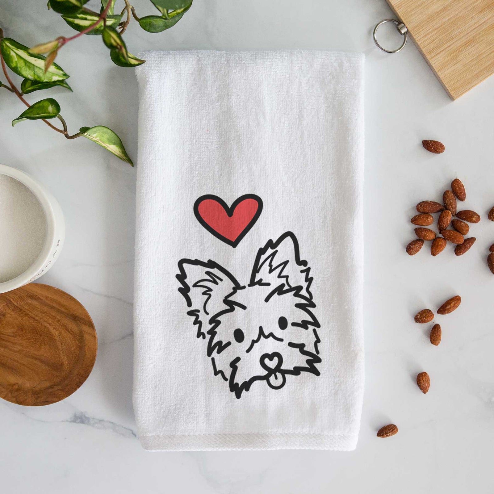 Minimalist line drawing of Luna the Yorkshire Terrier with a red heart on a decorative hand towel