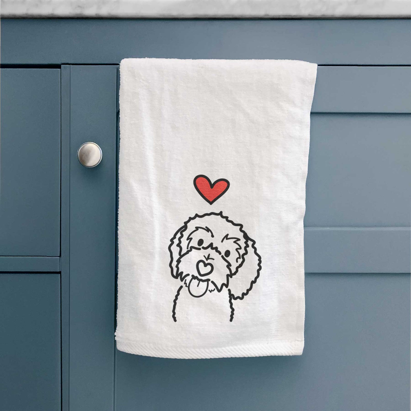Minimalist line drawing of Mabel the Bernedoodle with a red heart on a decorative hand towel